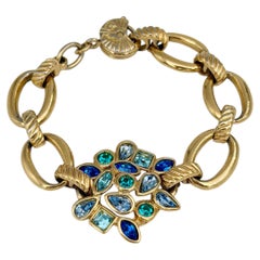 Bracelet vintage Yves Saint Laurent (YSL) des années 1990, à maillons dorés et cristaux bleus