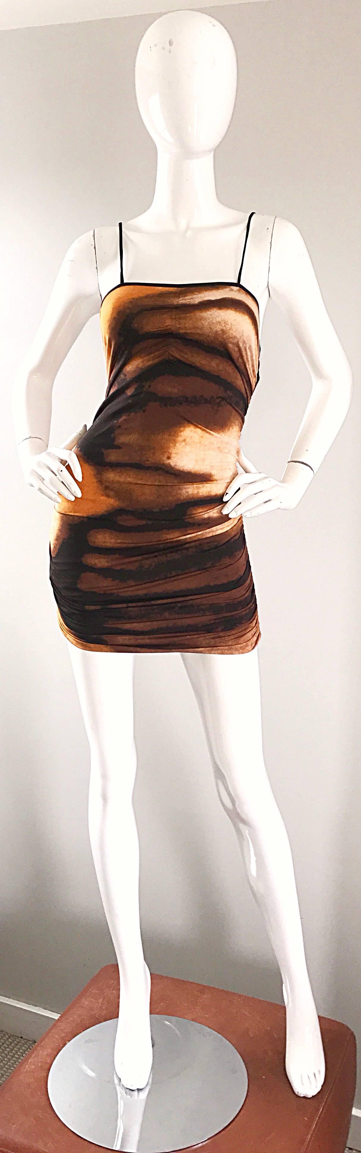 Sexy early 1990s VIVIENNE TAM abstract ruched bodycon mini dress! Features flattering and unique blurred brush strokes of brown, burnt orange, black and ivory throughout. Slimming ruched details down both sides of the dress. Simply slips over the
