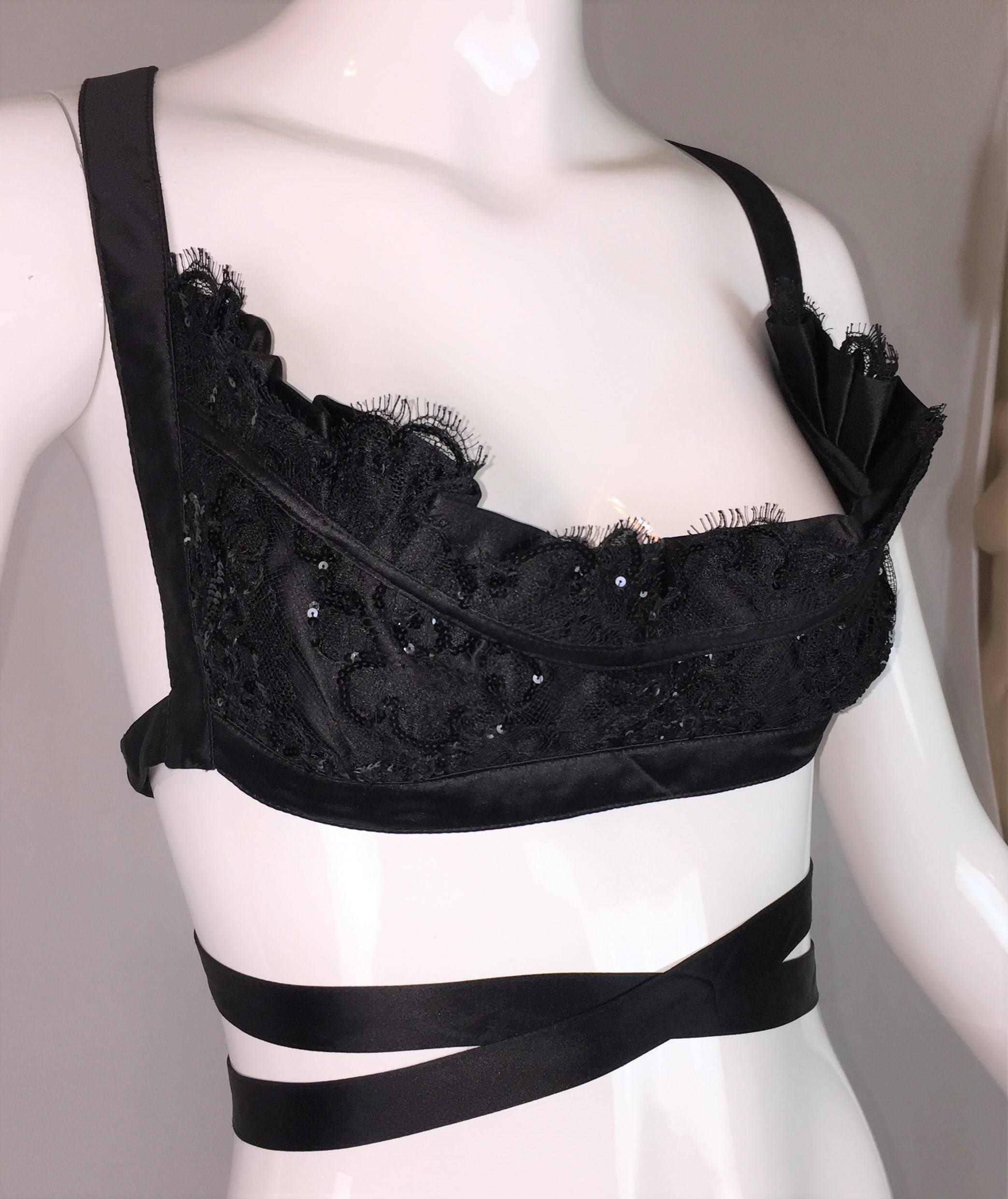 DESIGNER: 1990's Vivienne Westwood 

Please contact for more information and/or photos.

CONDITION: Excellent 

COUNTRY MADE: England

FABRIC: Unknown- feels like silk

SIZE: None- couture piece- its meant to show a lot of cleavage! If you need