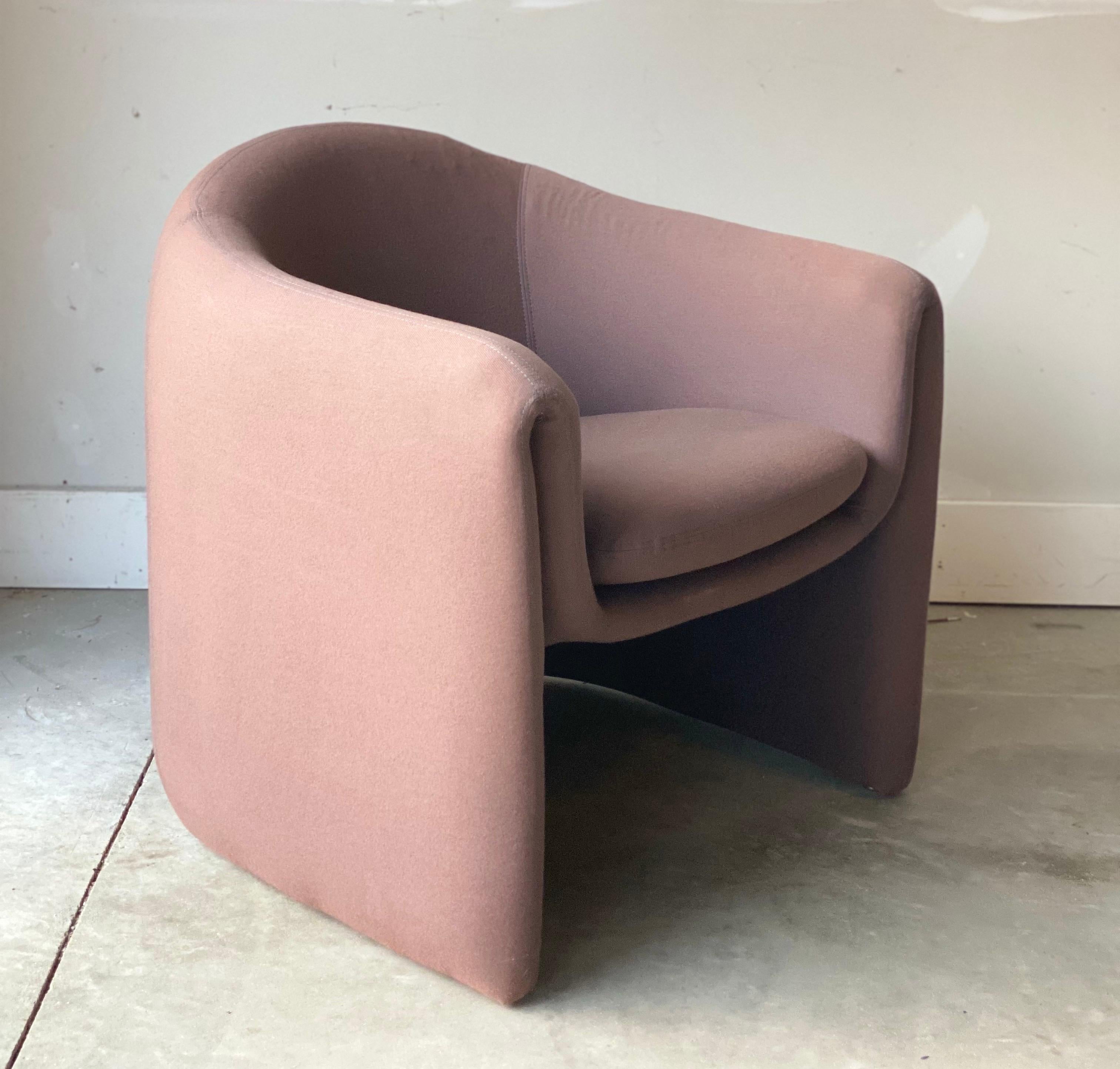 We are very pleased to offer a stylish, iconic, avant-garde chair by Vladimir Kagan for Preview, circa the 1990s. This piece is structurally sound, but fabric shows some wear and tear; thus, reupholstery is recommended. Marked on the bottom. Please