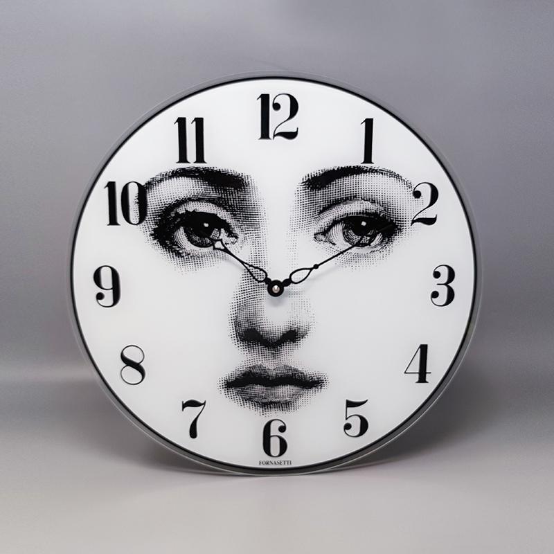 1990s Gorgeous wall clock in glass by Fornasetti it's signed on the bottom. Made in Italy. It's in excellent condition and it works perfectly with an AA battery (quartz mechanism by U.T.S)
Dimension:
diameter 14,17