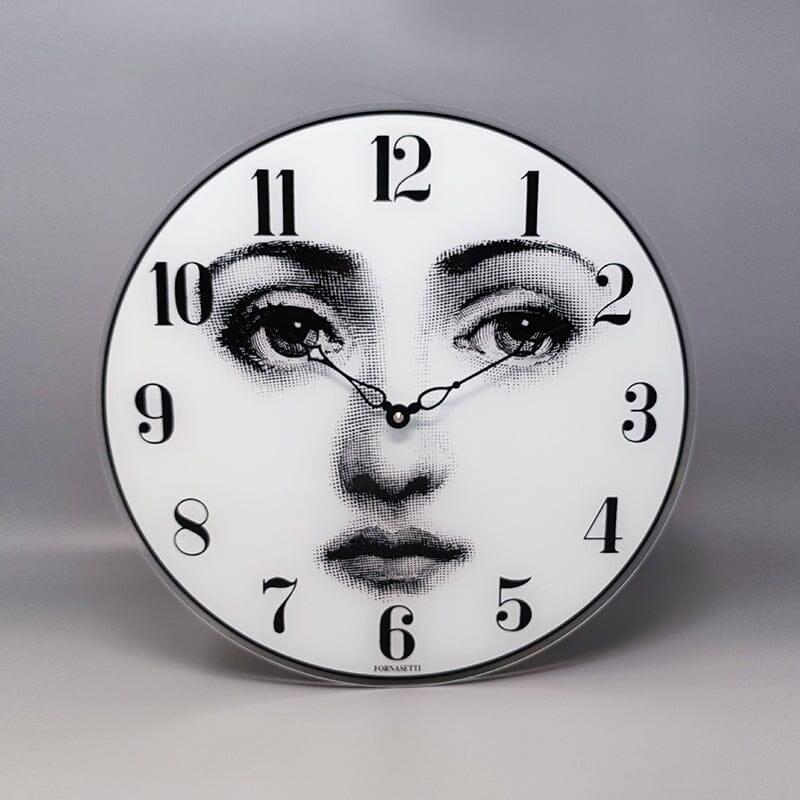 1990s Gorgeous wall clock in glass by Fornasetti it's signed on the bottom. Made in Italy. It's in excellent condition and it works perfectly with an AA battery (quartz mechanism by U.T.S)
Dimension:
diameter 14,17