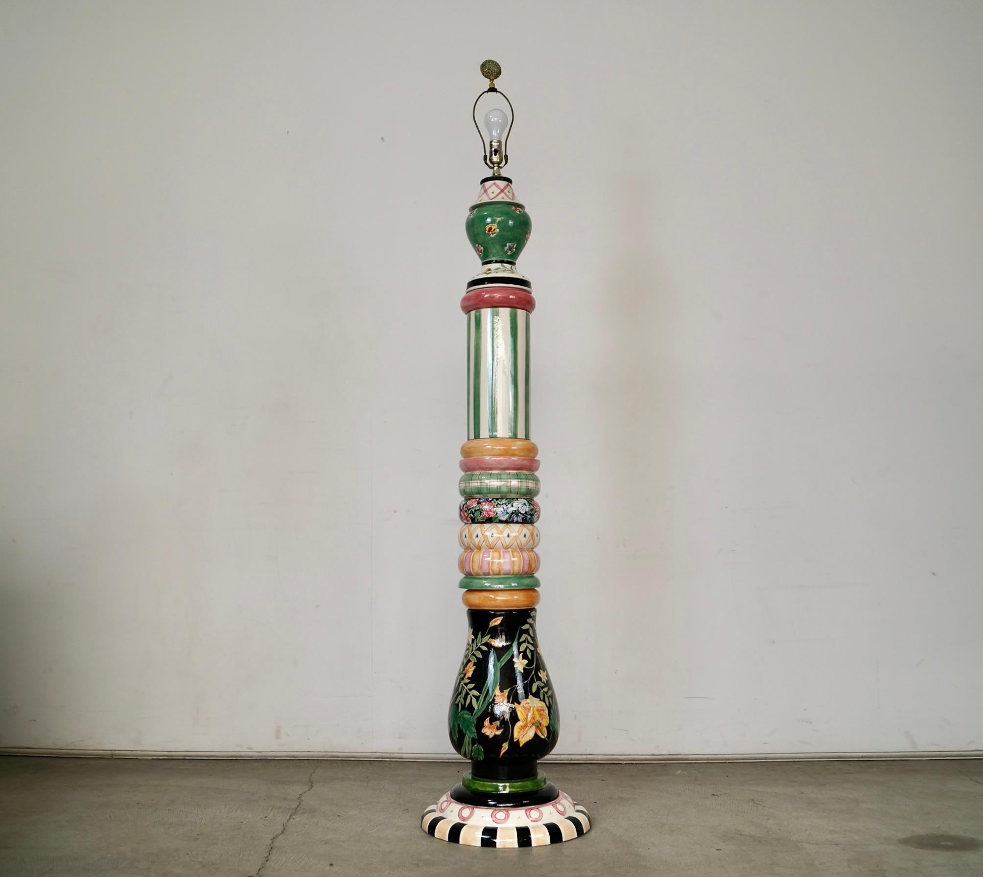 Vintage folk art floor lamp for sale. Manufactured by the unique and fabulous MacKenzie-Childs, and is a one-of-a-kind. It was hand painted by the artists and is signed and dated 1991. It features a wonderful use of colors and patterns, and is made