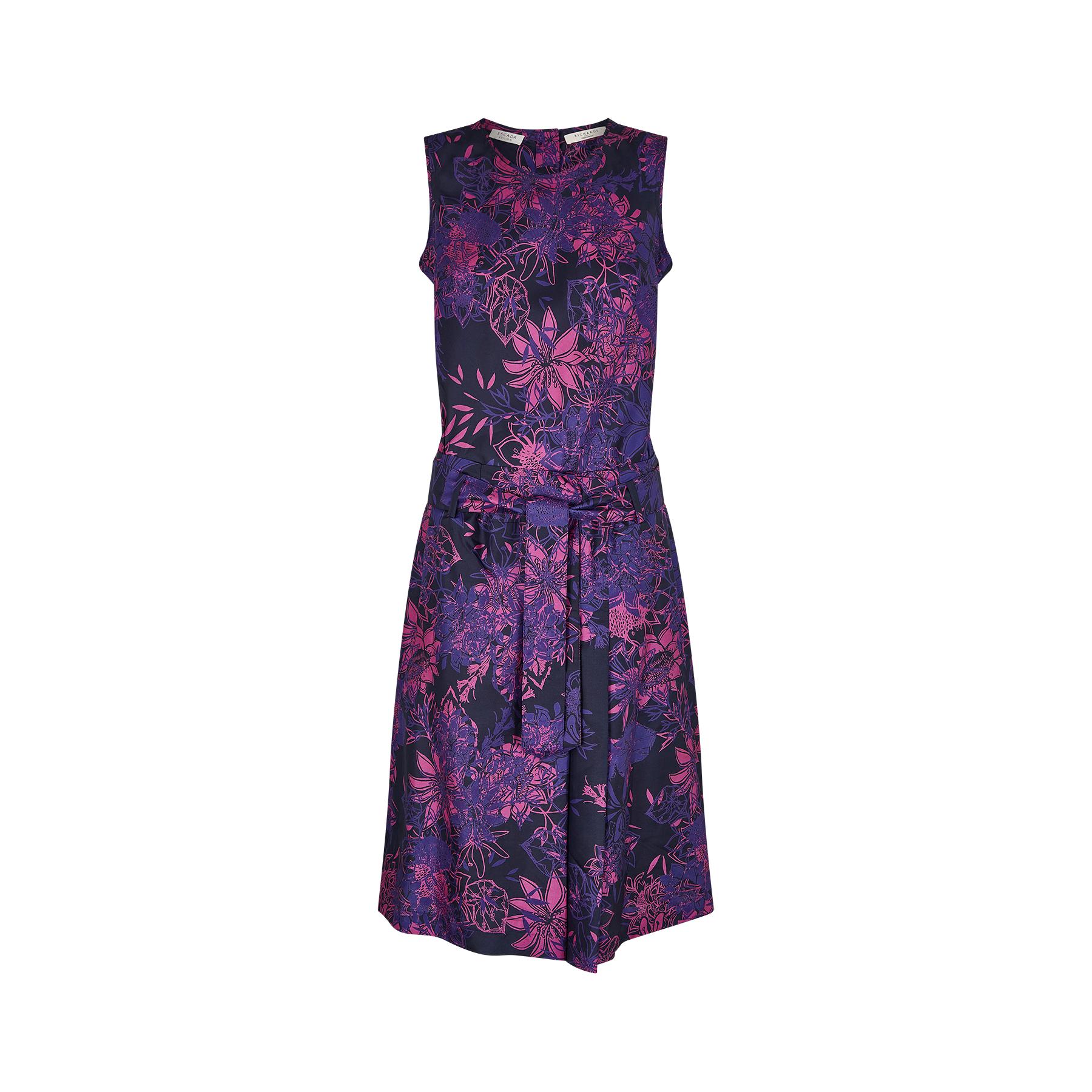 Sophisticated occasion dress from Escada, dating to the late 1990s or early 2000s. The dress has an abstract floral print in navy, purple and pink silk and is an unusual shirt-waister design designed to look like coordinating separates.  The back