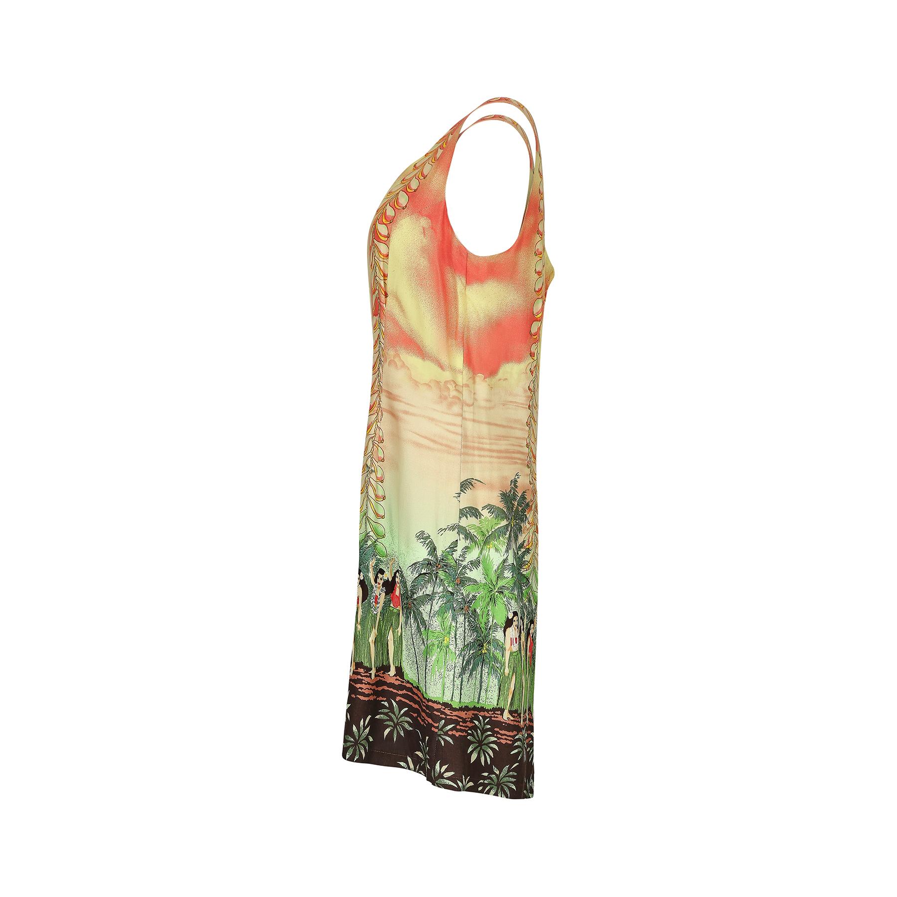 This 1990s or early 2000s Hawaiian dress is, in its most literal sense a 'Hawaiian dress' featuring a scenic print of lush vegetation, hula ladies, Hawaiian mountain ranges against a sunset gradient and a US Second World War fighter aircraft. It is