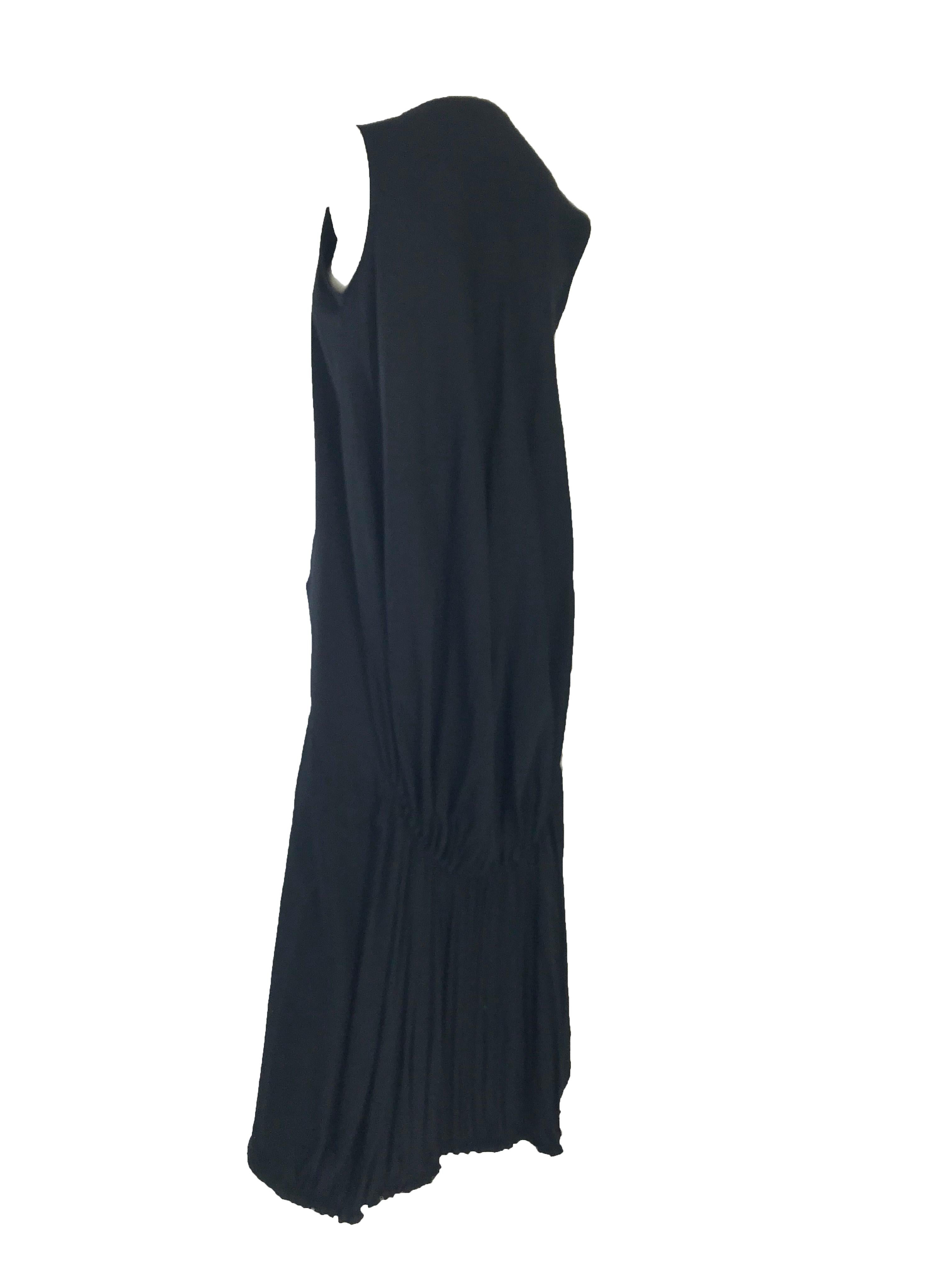 1990s Yohji Yamamoto black sleeveless gown with pleated hem. Two side pockets. 

Condition: Excellent
Made in Japan
Size Med
