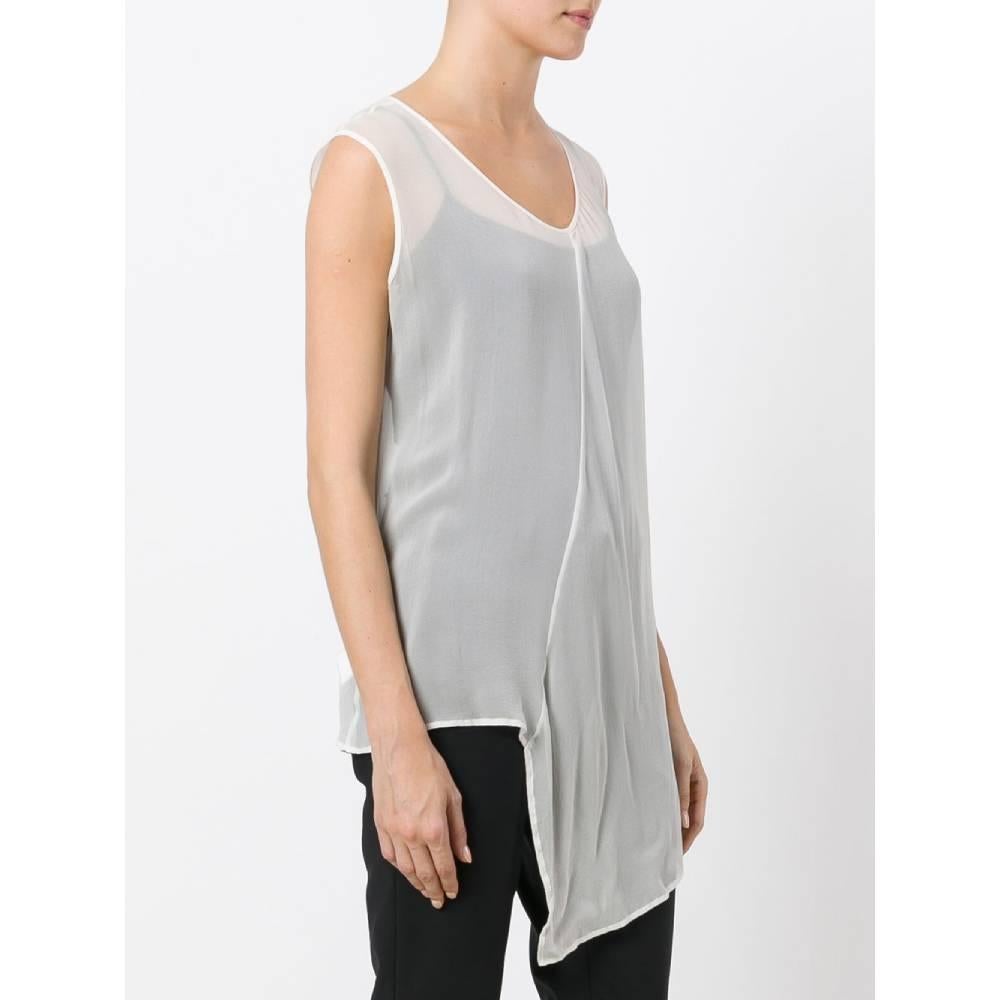 Yohji Yamamoto semi-transparent blouse in white silk, sleeveless and with an asymmetrical design.
Years: '90

Made in Japan

Size: 3 (46 IT)

Linear measures:

Height: 80 cm
Bust: 52 cm