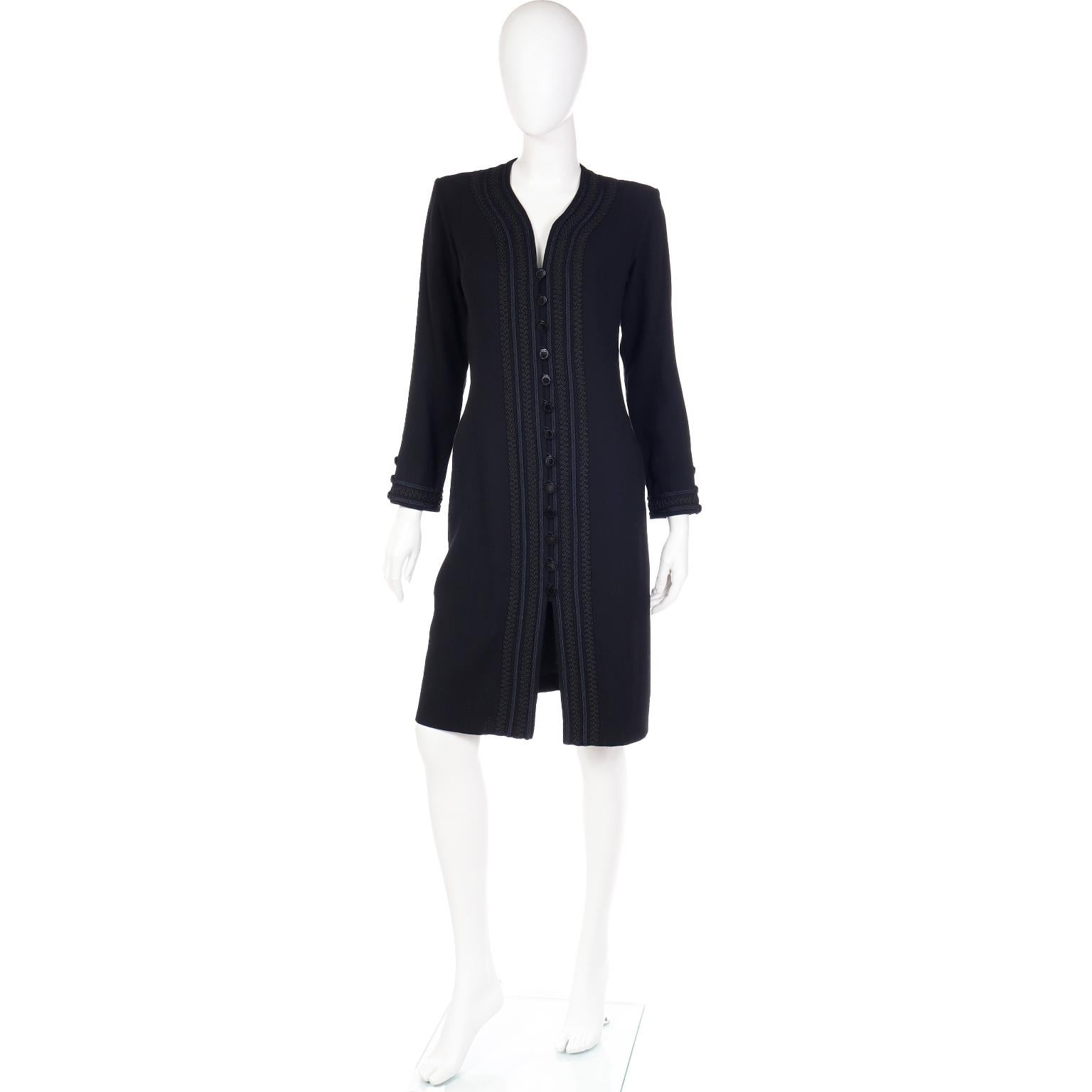 This vintage 1990's Yves Saint Laurent black lightweight wool crepe button front dress has the signature YSL braided style trim. This dress is so much more beautiful in person and it can also be worn unbuttoned as a duster over a pair of