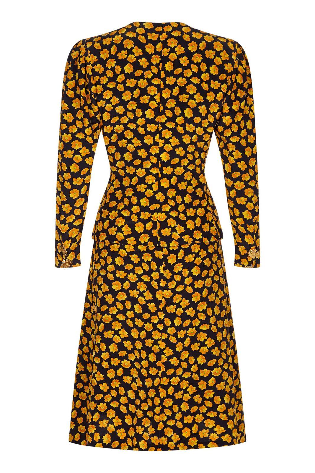This charming Yves Saint Laurent 1980s or early 1990s 2 piece silk set is in pristine condition and wonderfully adaptable as separates. The vibrant golden yellow floral design is playful and gamine, yet could still communicate well in a formal
