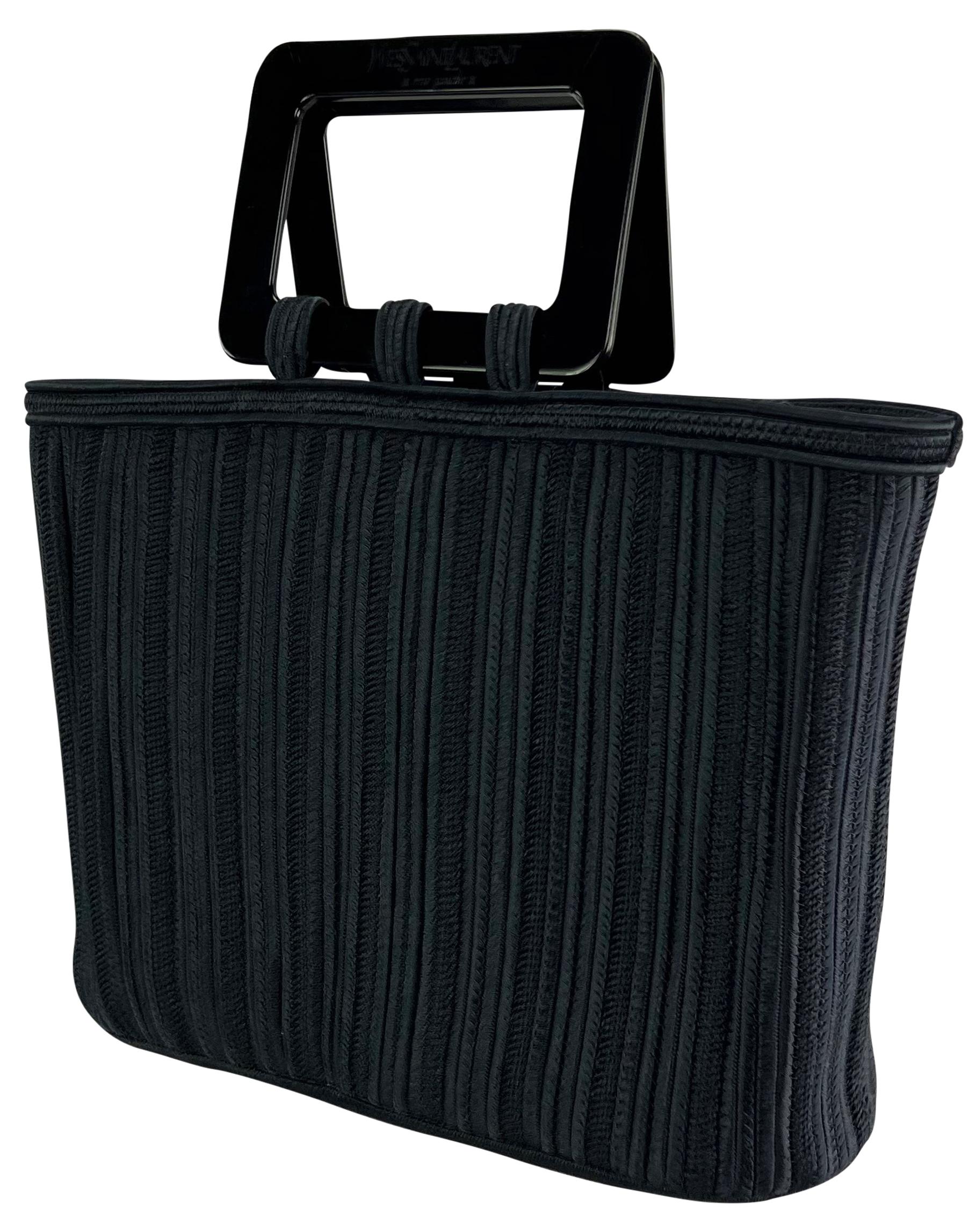From the 1990s this chic woven navy Yves Saint Laurent Rive Gauche top handle tote bag features an entirely woven body and is complete with a black square acrylic handle. Effortlessly chic and stylish, this vintage YSL woven tote is a must-have