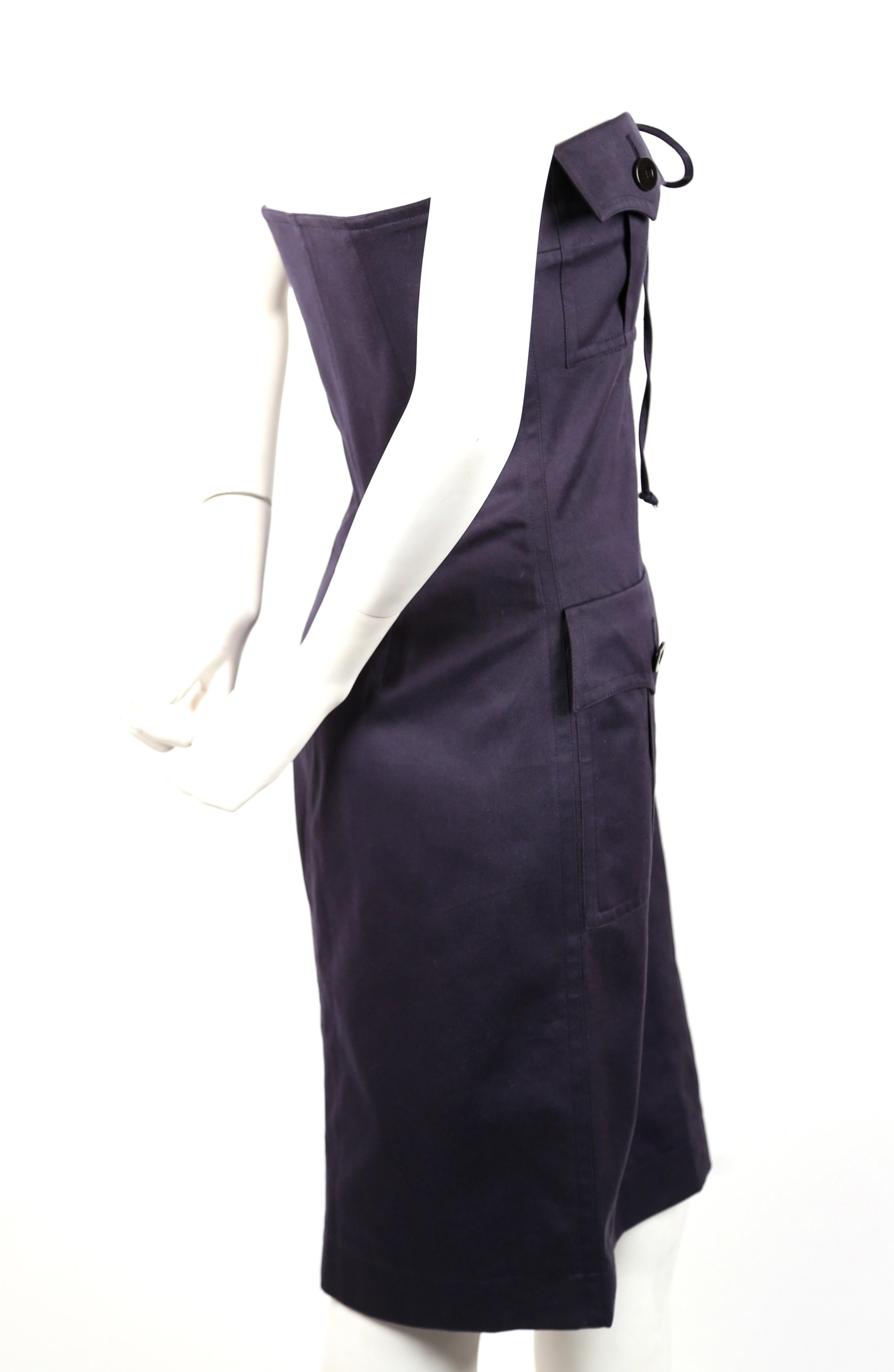 Navy blue, strapless, cotton, safari dress designed by Yves Saint Laurent dating to the early 1990's. French size 38. Best fits a US 2 or small-busted 4. Dress can be adjusted with ties but is best for a 31-33