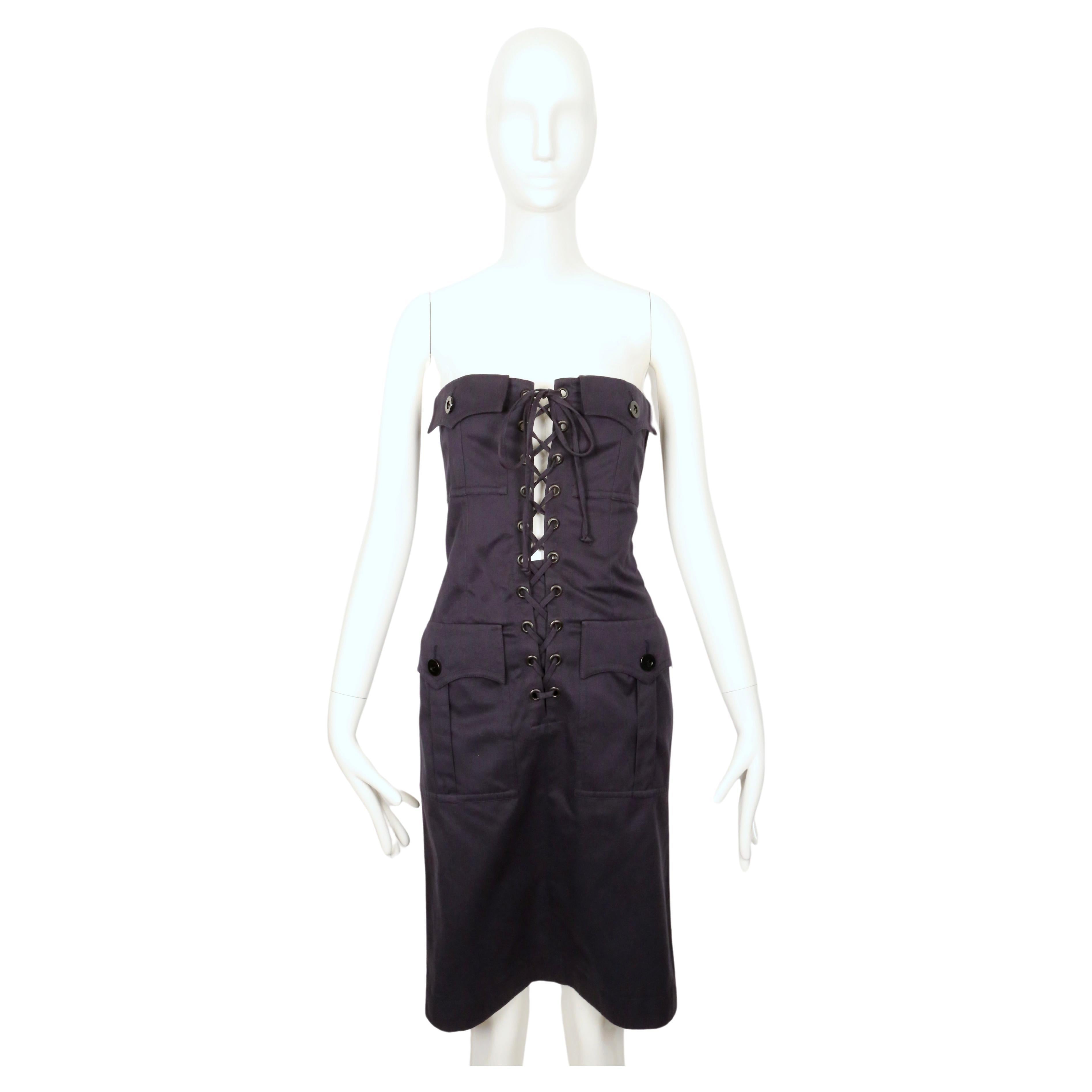 Navy-blue, strapless, cotton, safari dress designed by Yves Saint Laurent dating to the early 1990's. French size 38. Best fits a US 4 or slim 6. Dress was about one size too large on the size 2 mannequin. Dress can be adjusted with ties but is best