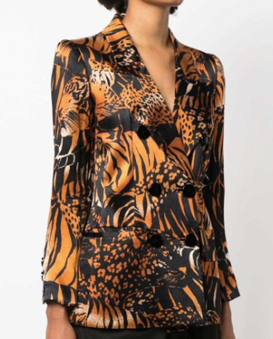 Yves Saint Laurent YSL iconic silk printed jacket featuring an animal print, a long length and long sleeves with buttons at cuffs. 
Circa 1990s
Composition: 100% silk
Estimated size 38fr/US6 /UK10
Made in France. 
In good vintage condition. 
We