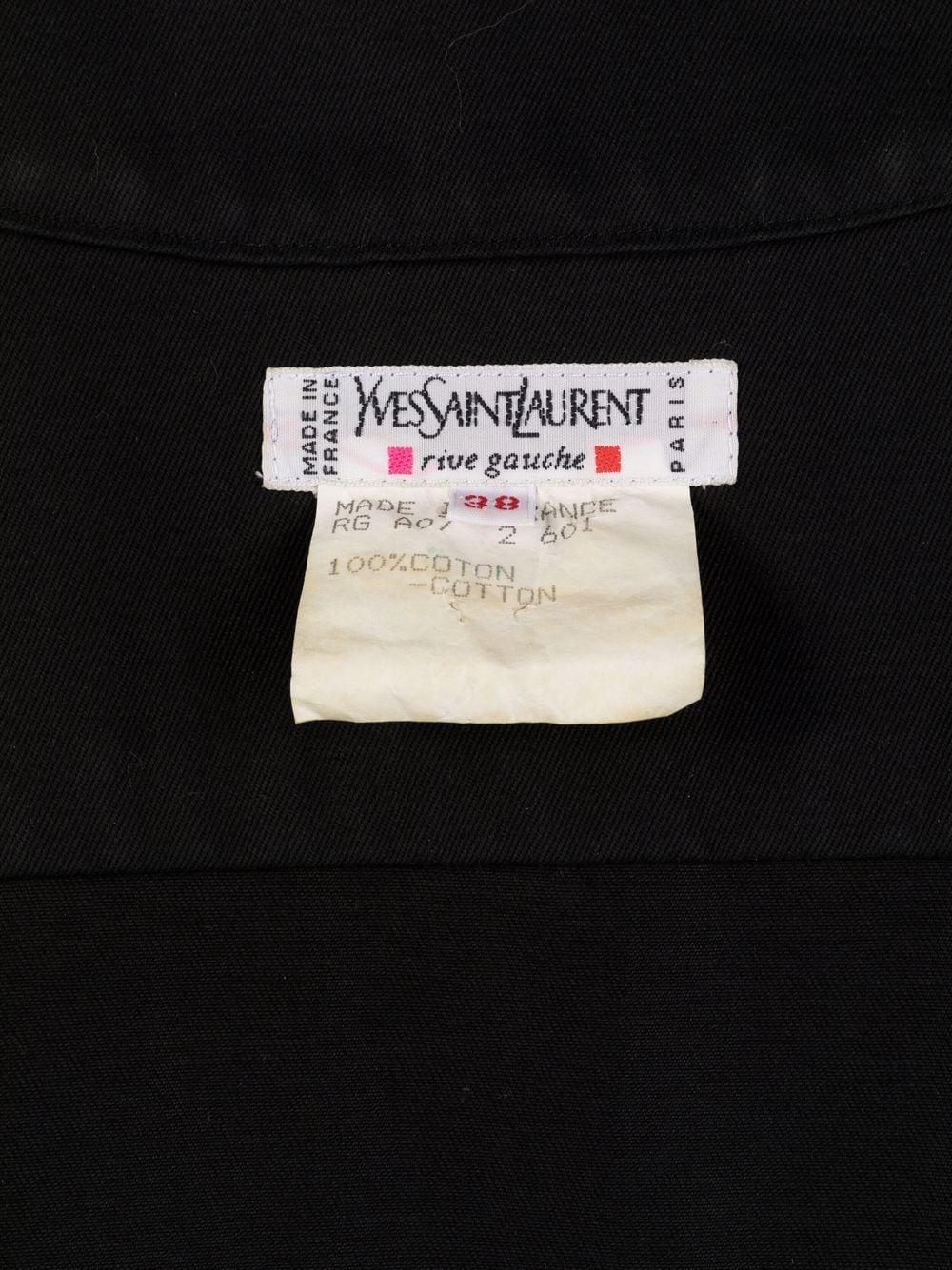 1990s Yves Saint Laurent  black safari cotton dress featuring a front and side lace-up detailing, turn-up cuffs, short sleeves, V-neck.
100% cotton
Estimated size Estimated size 38fr/US6 /UK10 
In good vintage condition. 
Made in France. 
We