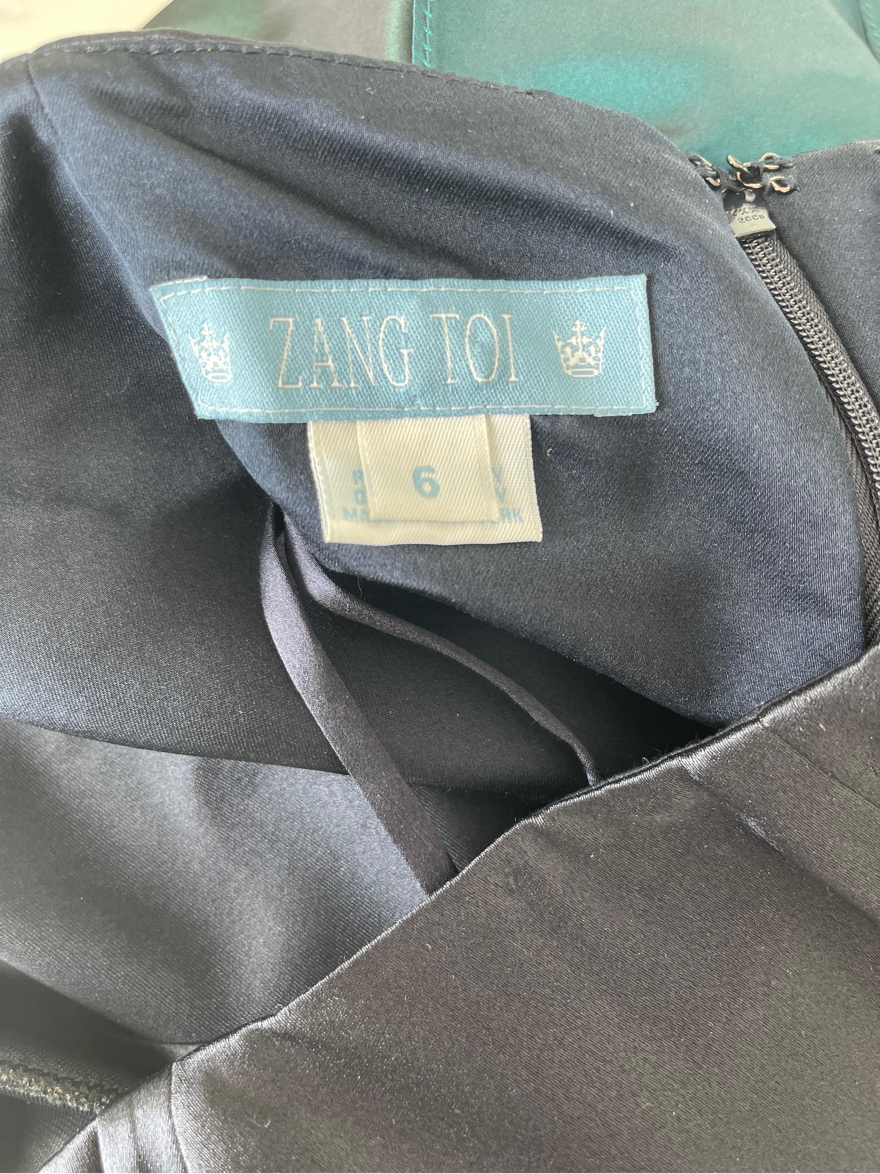 Gorgeous late 90s ZANG TOI navy blue strapless silk flamenco style gown ! This dress is so fun, and designed with so much attention to details. The side features tiers of silk taffeta and chiffon in blues and greens. Hidden zipper up the back with