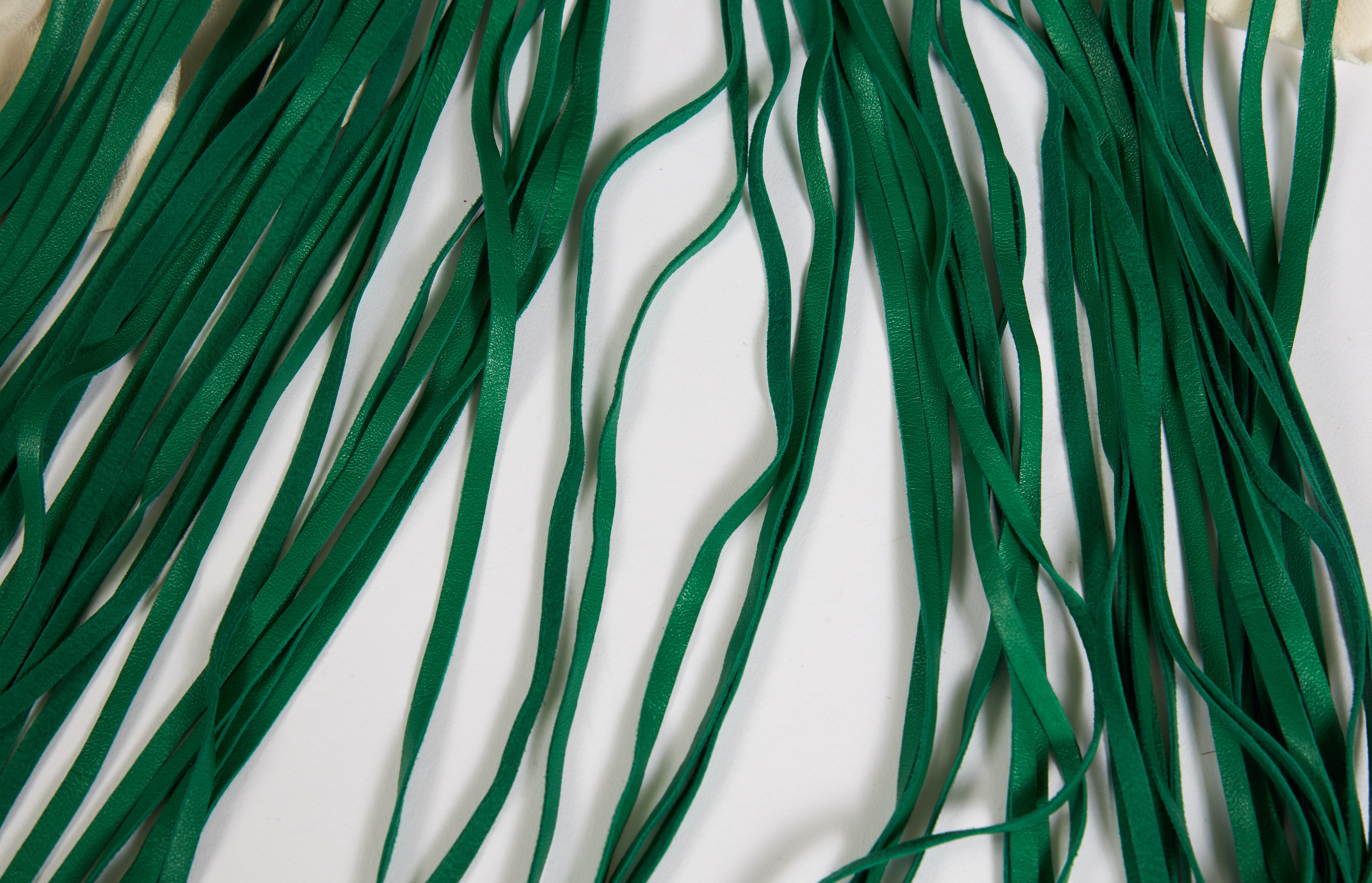 Rare and collectible 90s emerald green cashmere and leather fringe shawl. Minor wear . 70% cashmere, 30% wool. Discontinued item originally price at 4300$.