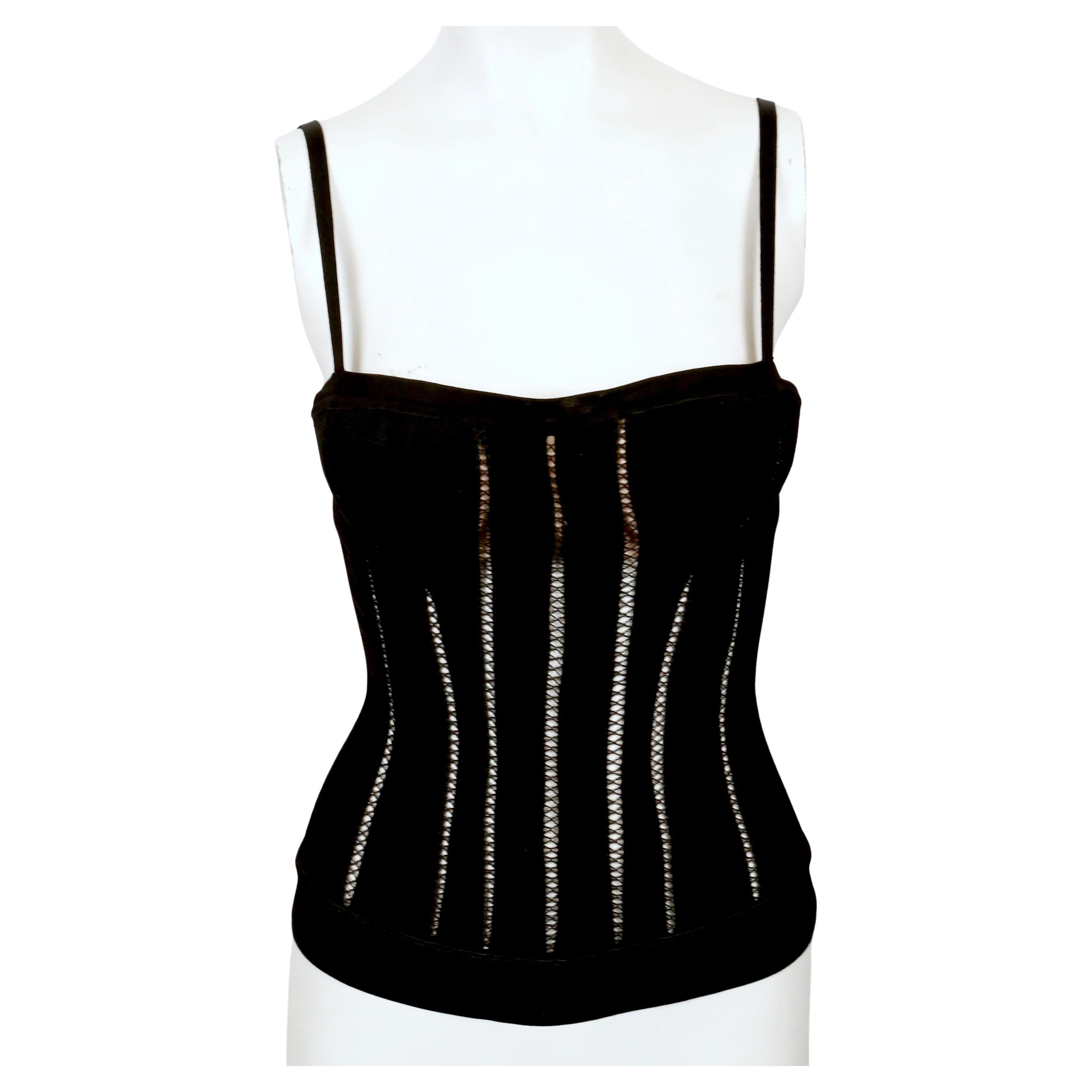 Black knit corset top with decorative stitching and attached padded push-up bra designed by Azzedine Alaia dating exactly as seen on the fall 1991 runway and countless editorials. Labeled a Size 'S' and best fits an XS or S.  Made in Italy. Center