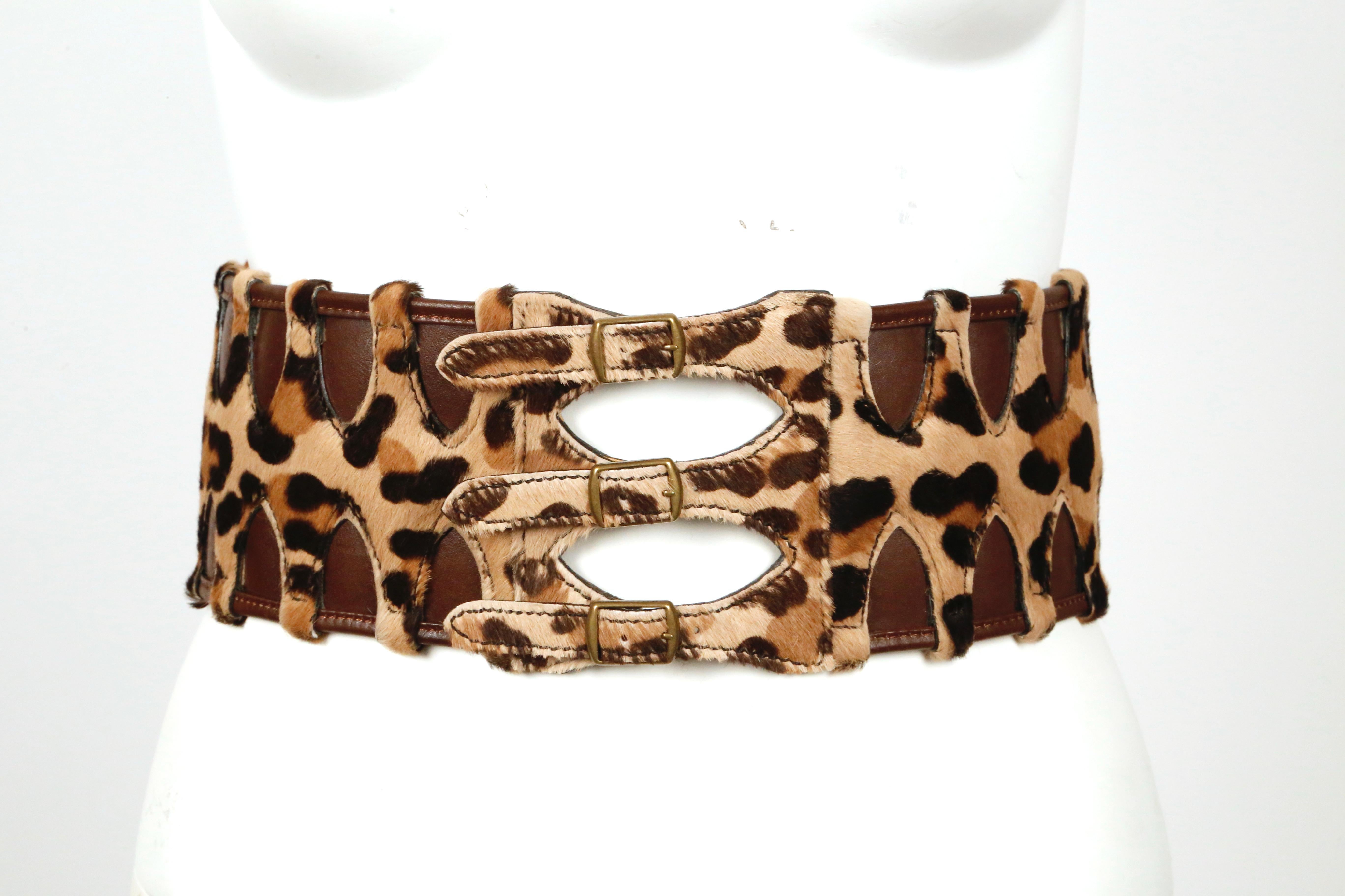 Very rare, leopard-print, pony fur and brown leather corset belt from Azzedine Alaia dating to 1991. Labeled a French size 70. Belt measures just under 4