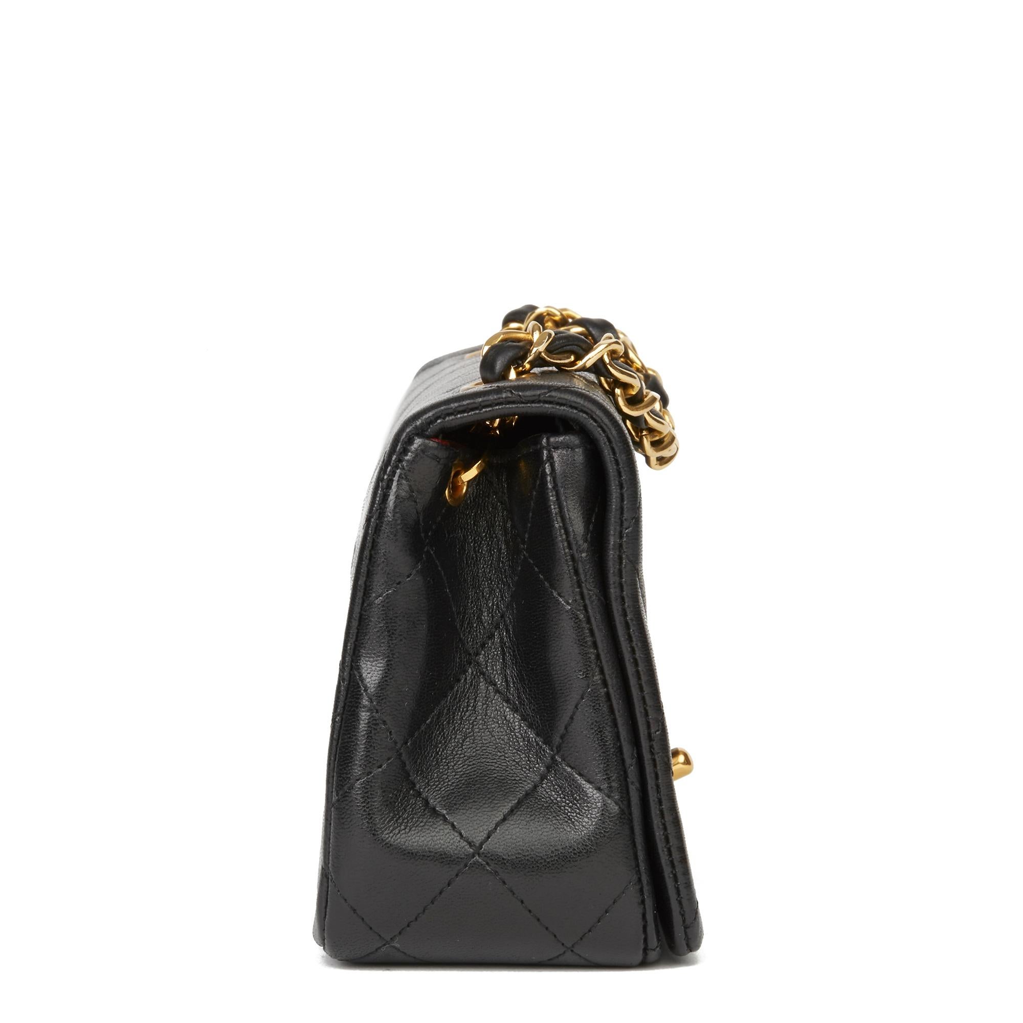 CHANEL
Black Quilted Lambskin Vintage Mini Flap Bag

Reference: HB2812
Serial Number: 1281900
Age (Circa): 1991
Accompanied By: Chanel Dust Bag, Box, Authenticity Card
Authenticity Details: Serial Sticker, Authenticity Card (Made in France)
Gender: