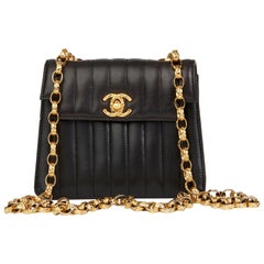 1991 Chanel Black Vertical Quilted Lambskin Vintage Mini Flap Bag