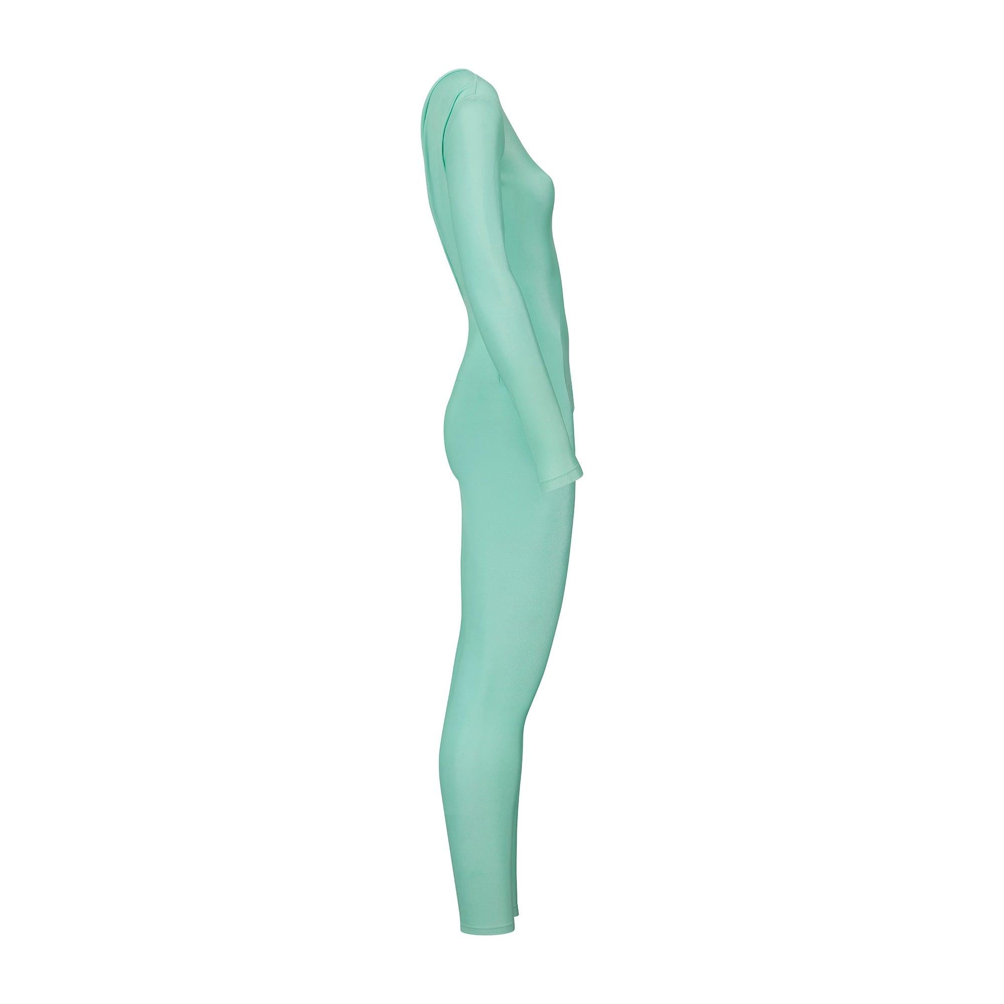 This eye-catching catsuit was designed by Gianni Versace during his time at the helm of his namesake company. Dragging ‘80s signatures into the early-’90s, this catsuit is sleekly tailored from vivid mint green Lycra and cut to a long-sleeved,