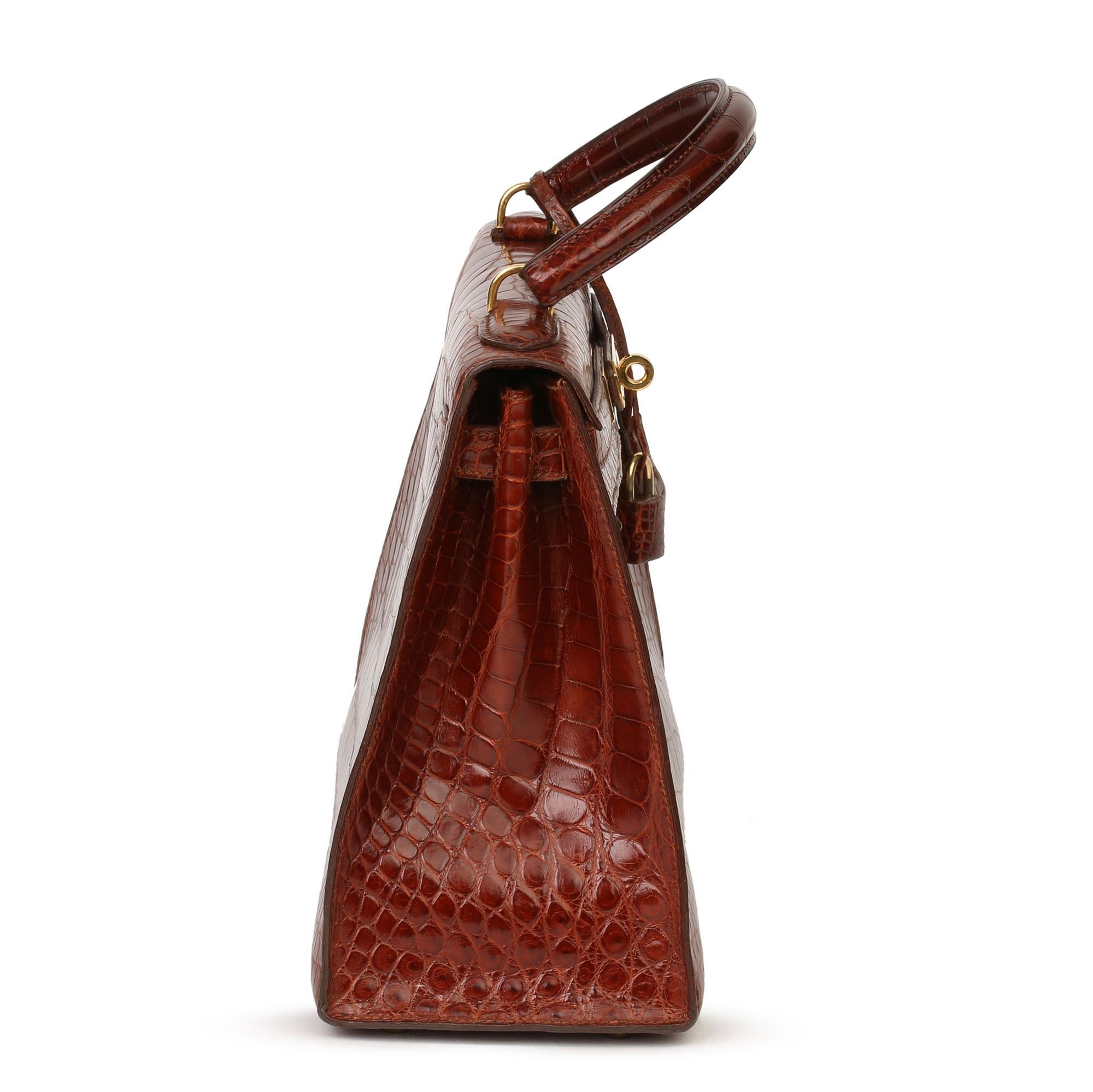 HERMÈS
Miel Shiny Alligator Leather Vintage Kelly 28cm Sellier

Xupes Reference: HB3857
Serial Number: (U)
Age (Circa): 1991
Accompanied By: Hermès Dust Bag, Padlock, Keys, Clochette, Shoulder Strap, Receipt, CITES
Authenticity Details: Date Stamp