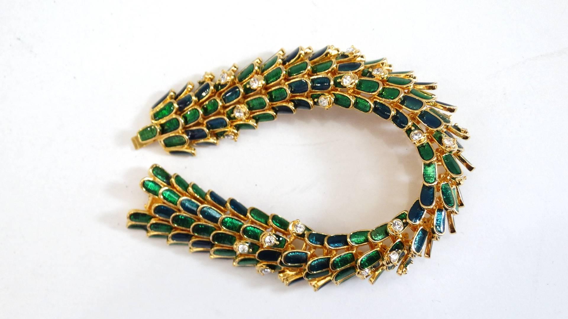 Channel your inner fierceness with our KJL by Kenneth Jay Lane enamel dragon scale bracelet! Made of a brilliant and shiny gold metal, with contrasting jewel beetle green enamel on each of the 