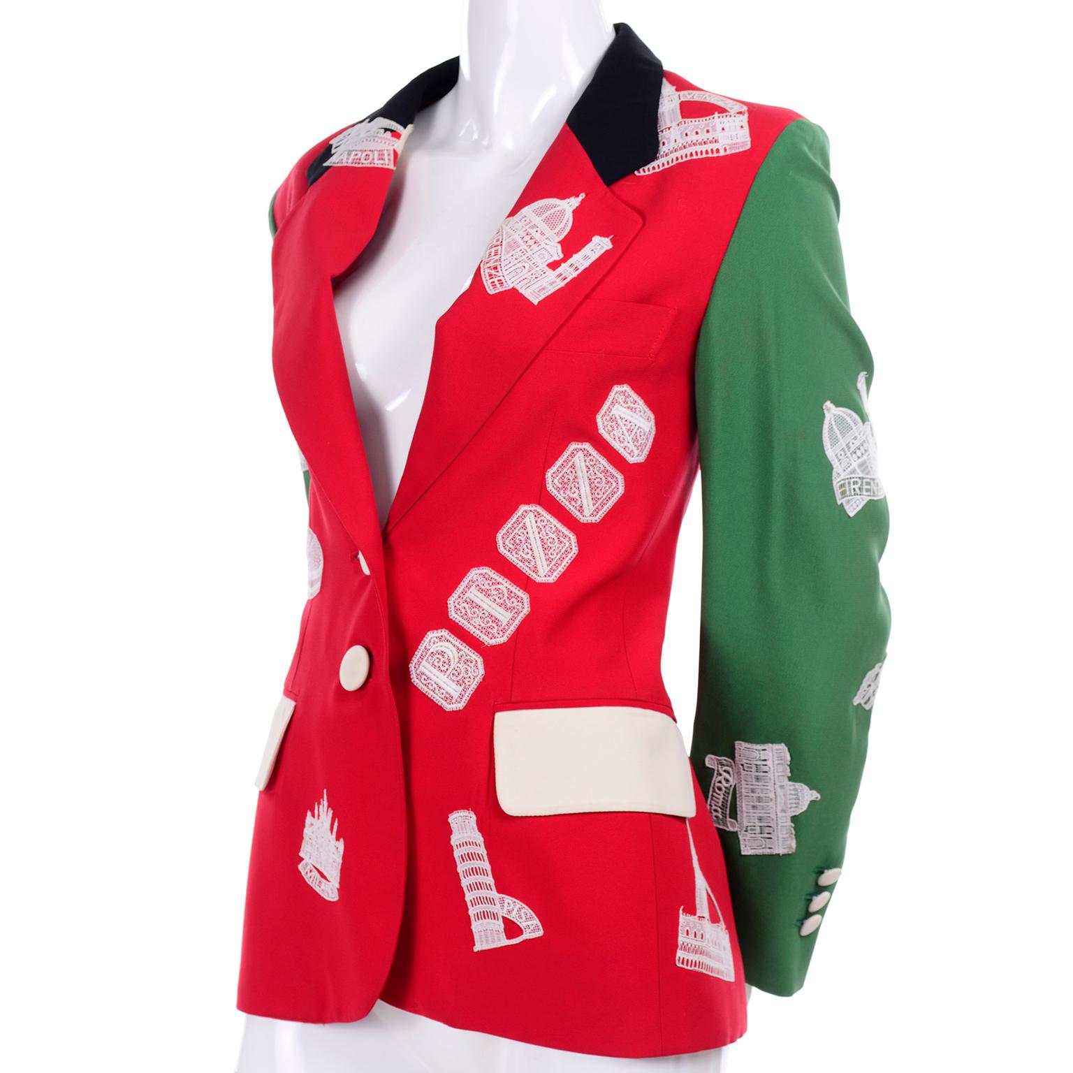 This rare Moschino blazer is from the Moschino Couture! 1991 Spring Summer Collection.  The jacket was designed by Franco Moschino and features a red body, ivory pocket flaps, a black collar and green sleeves.  The piece is appliqued with white lace