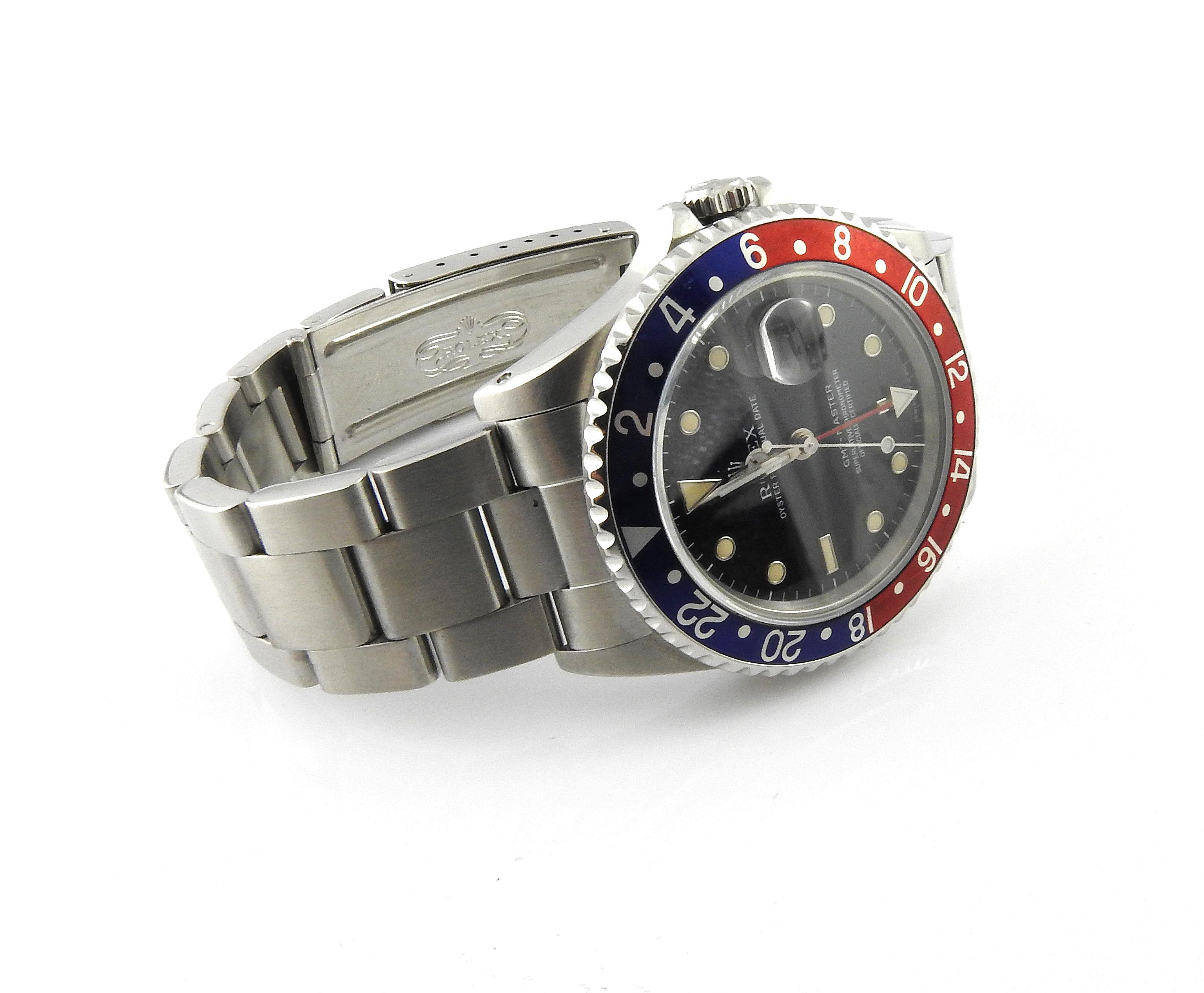 991 Rolex GMT - Master Pepsi Watch

Model: 16700
Serial: N304115

Pepsi bezel - red and blue - original to watch

40 mm stainless steel case

Black Dial

Stainless Steel Oyster Band - 7 3/4