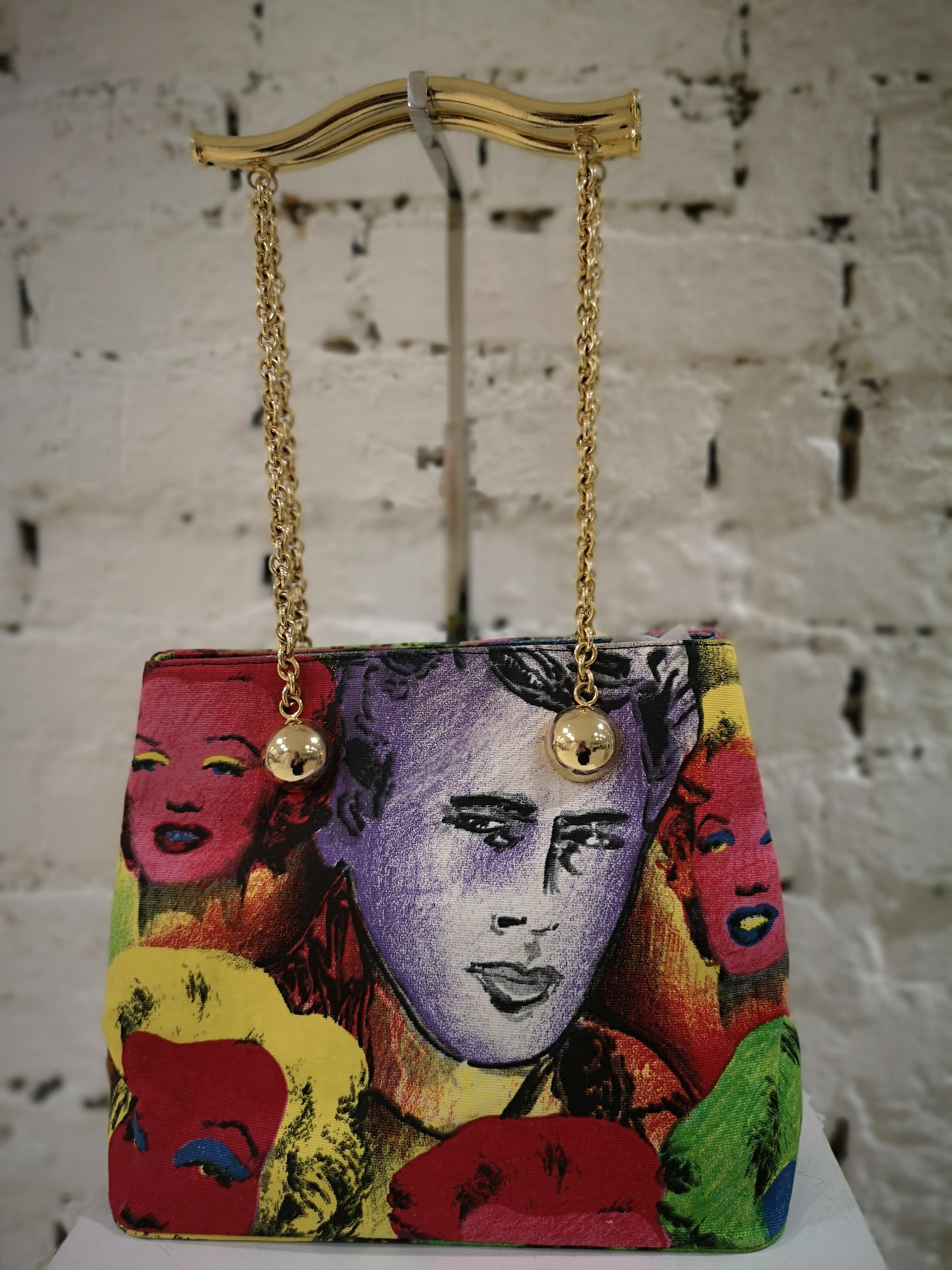 1991 Versace Marilyn Monroe James Dean Warhol bag
unique and rare bag from Gianni Versace 1991 Warhol Collection
this unique piece is made from painted canvas, it rapresents Versace's debute to Warhol
Gold tone hardware and gold tone handle
this