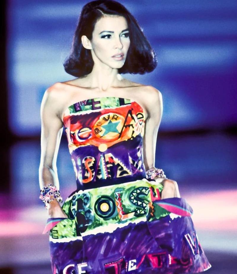 VERSACE 1991

Drop dead gorgeous vintage Gianni Versace Couture dress from SS 1991, documented and shown here on the runway. Incredible, bold, colorful abstract print on this voluminous, structured silhouette. Strategically placed net poofs at each