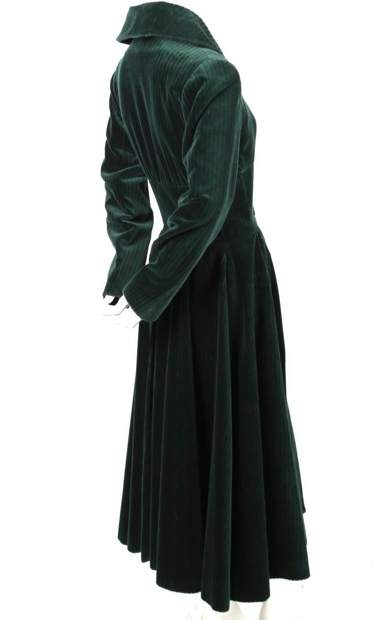 Very rare, deep-forest green, wide-wale velvet coat with corseted waist from Azzedine Alaia dating to fall of 1992 as seen on the runway. Coat is labeled a French 38 which best fits a size 4. Approximate measurements: shoulders 16.5