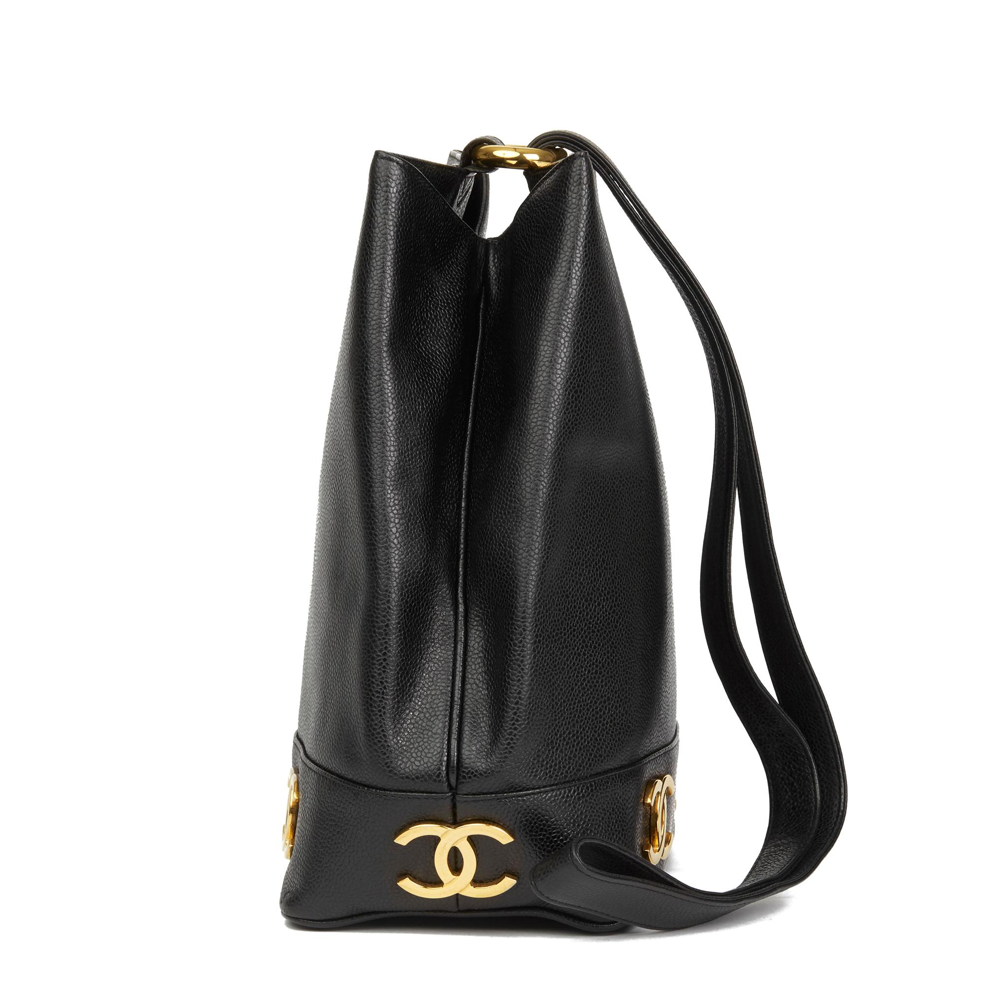 CHANEL
Black Caviar Leather Vintage Logo Trim Bucket Bag

 Reference: HB2893
Serial Number: 2896889
Age (Circa): 1992
Accompanied By: Chanel Dust Bag, Authenticity Card
Authenticity Details: Authenticity Card, Serial Sticker (Made in Italy)
Gender: