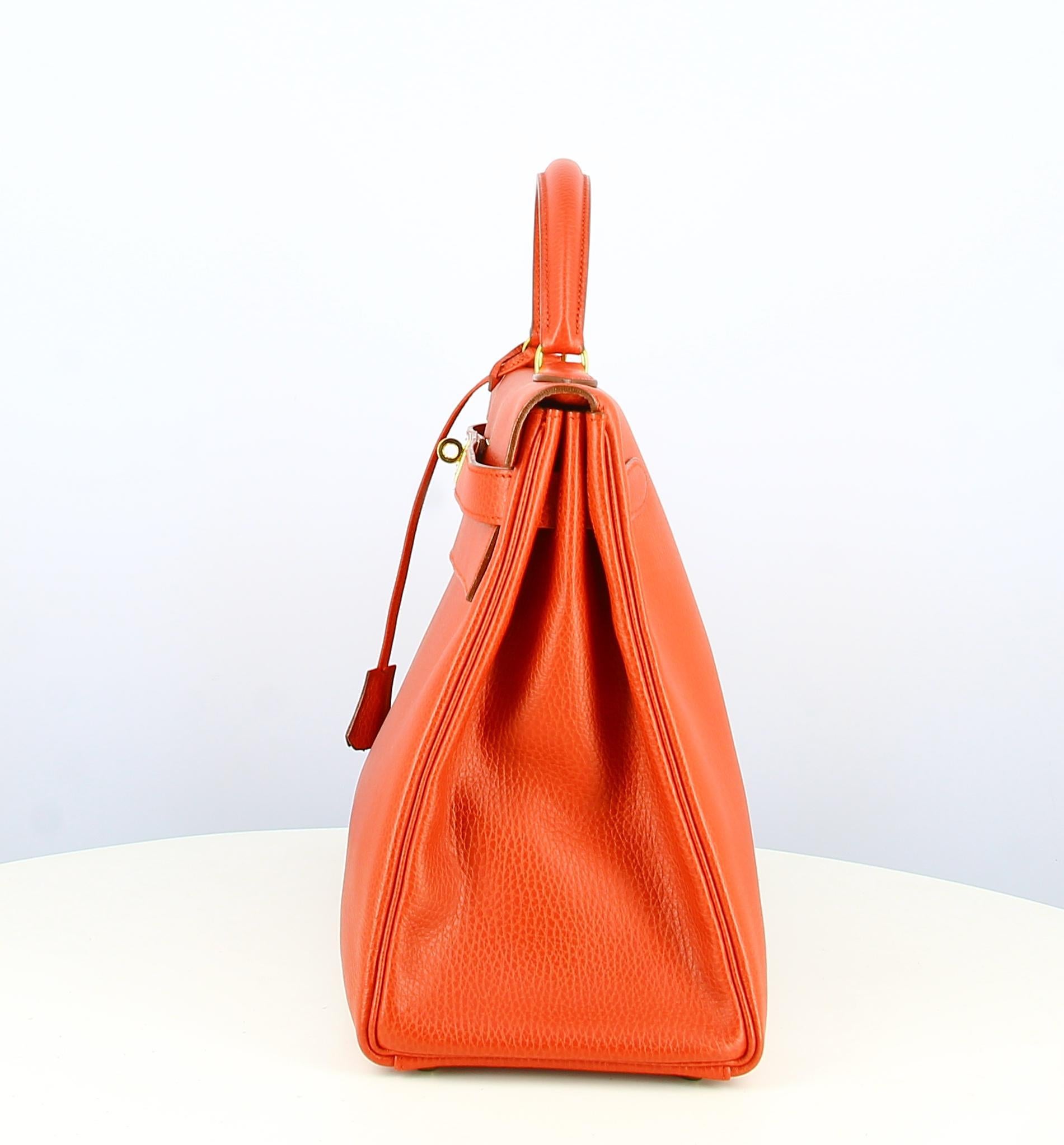 1992 Hermès Kelly 40 Handbag In Red Ardennes Leather
- Very good condition. Slight traces of wear over time.
- Hermès Kelly Bag 
- Courchevel leather. Small hanses. 
- Clasp: Golden
- Interior: Smooth red leather. Large golden zipped inside pocket.