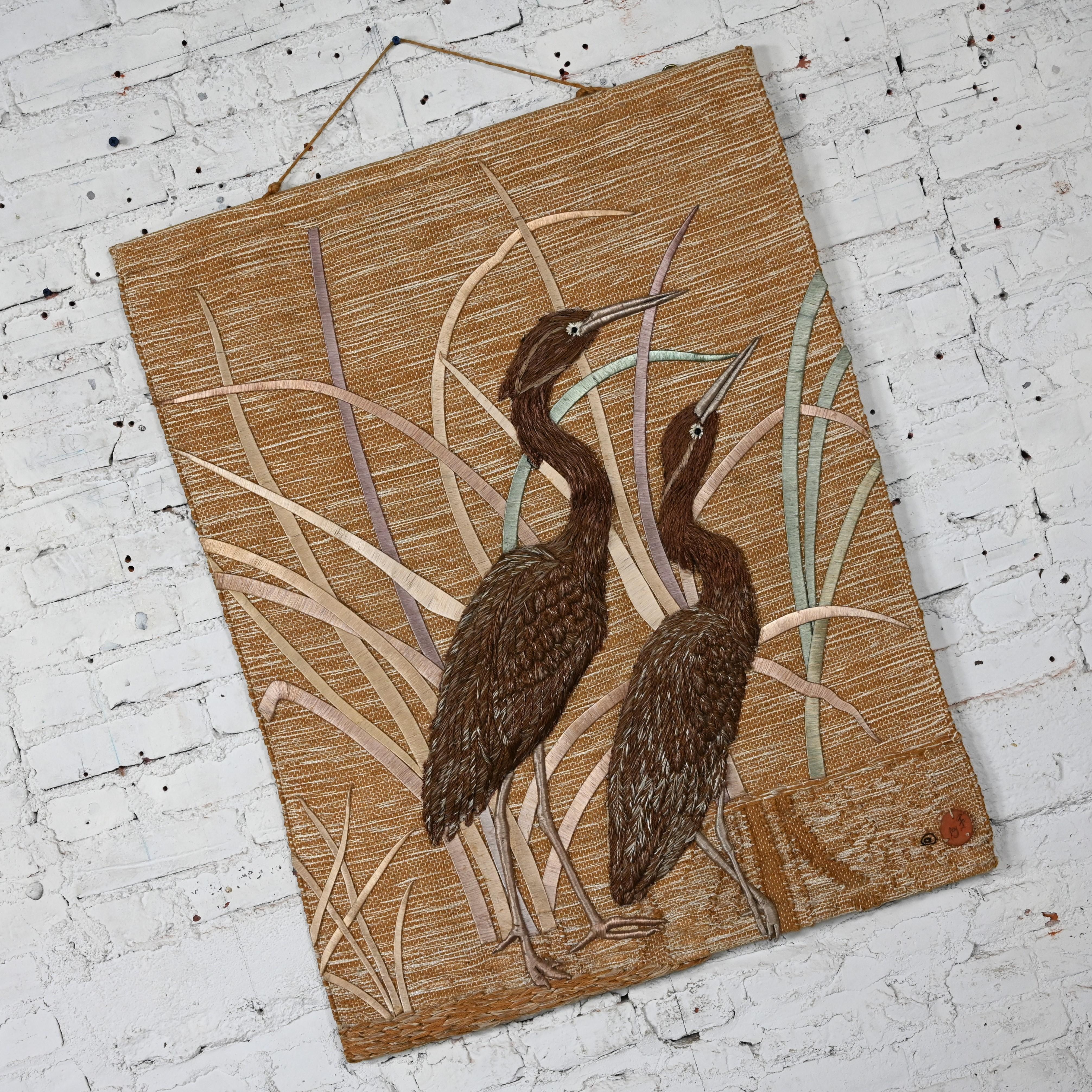Wonderful Modern textile hand woven wall hanging #418 of cranes & grass by Don Freedman c/o Tree Time Inc. for Interlude. Comprised of a composition of jute, silk, wood, and cotton. Beautiful condition, keeping in mind that this is vintage and not