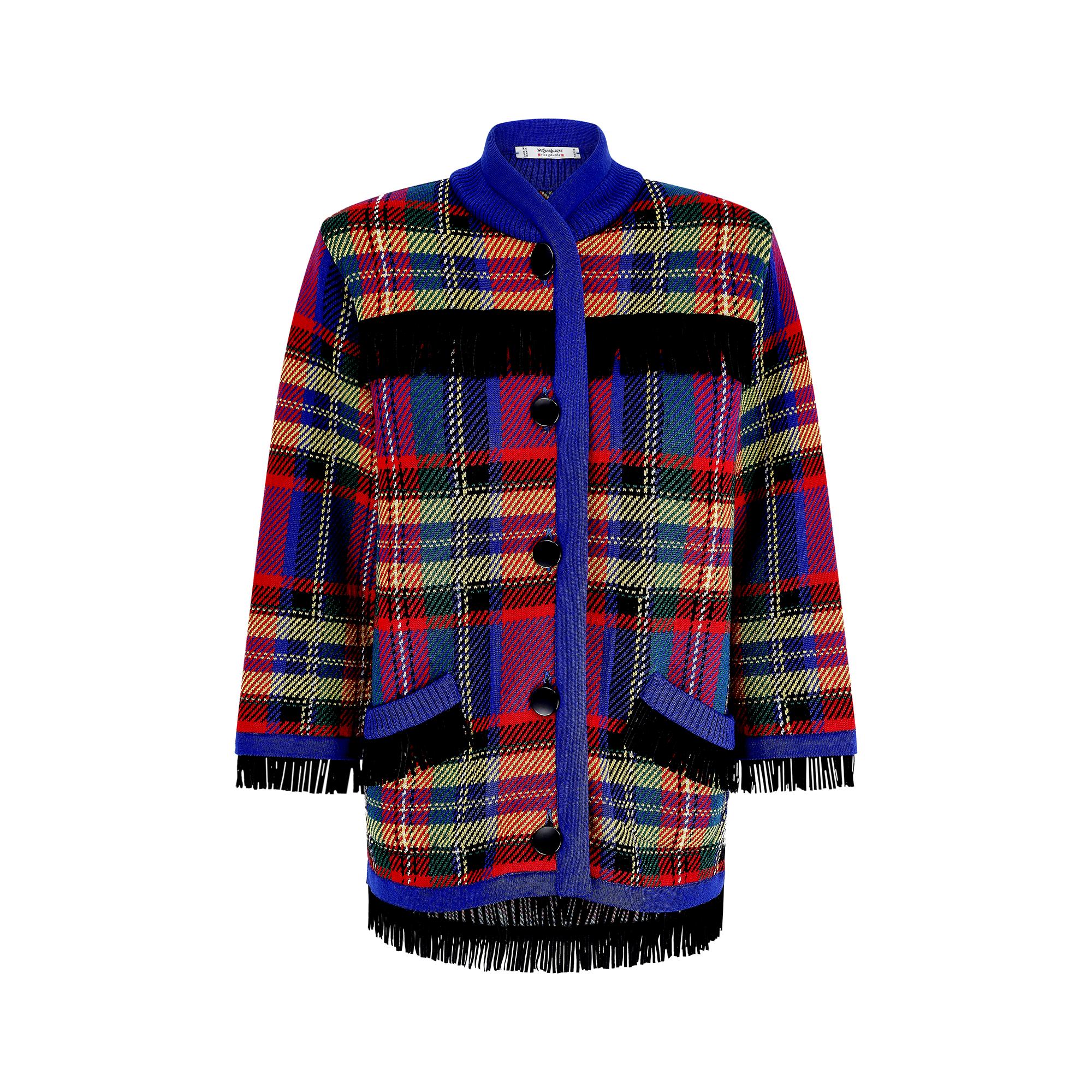 Documented Yves Saint Laurent tartan woolen jacket from the autumn / winter 1992 Ready to Wear Runway Show and model on the catwalk by Betty Prado.

Oversized fit and made from a soft, knitted 100% lamb wool, it features an unusual black fringe