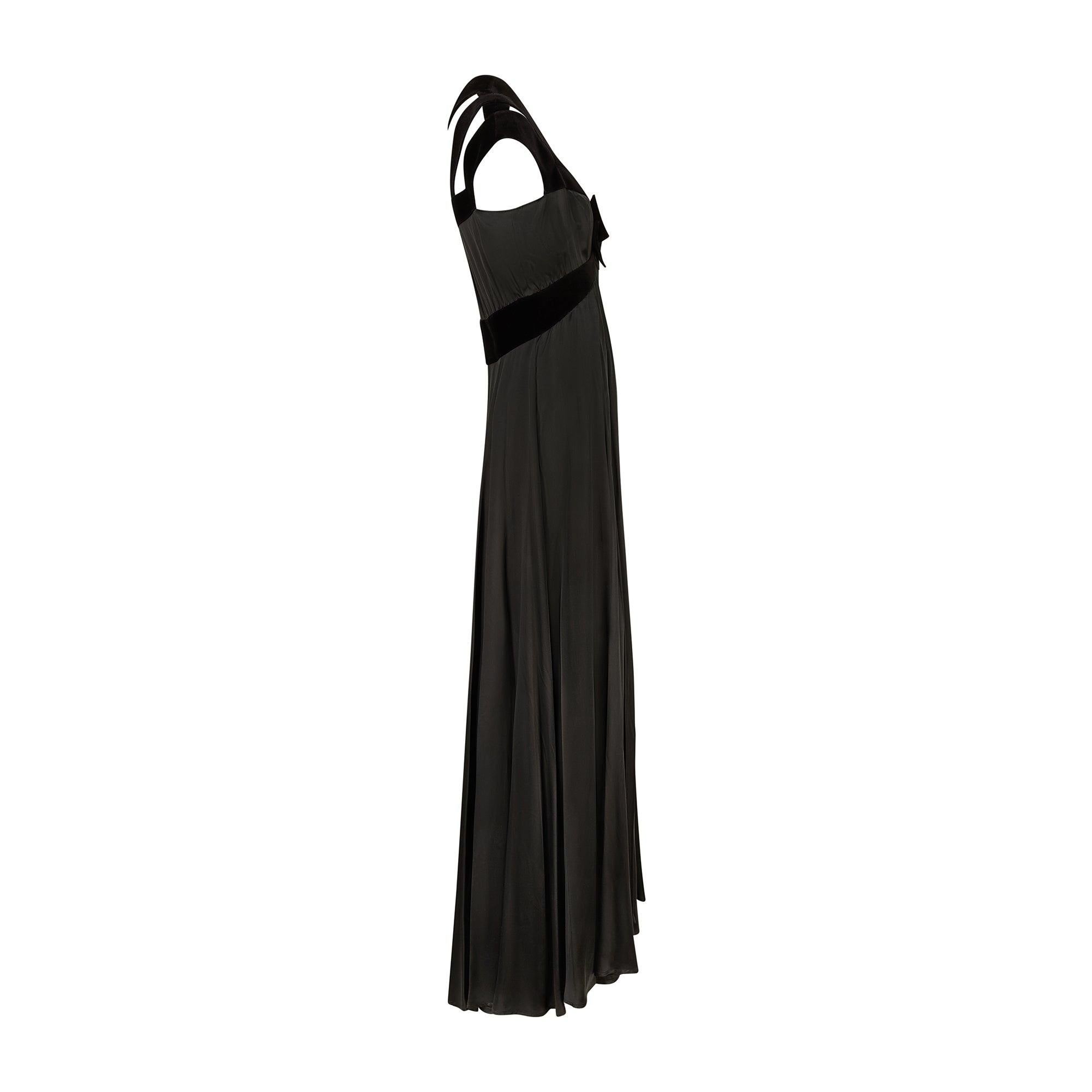 This spectacular black satin and velvet maxi gown walked the runway as part of Thierry Mugler’s iconic Spring 1992 collection (Look 18/84). It has been exhibited as part of the Alaïa et Mugler exhibition at the Fondation Azzedine Alaïa in Paris, and
