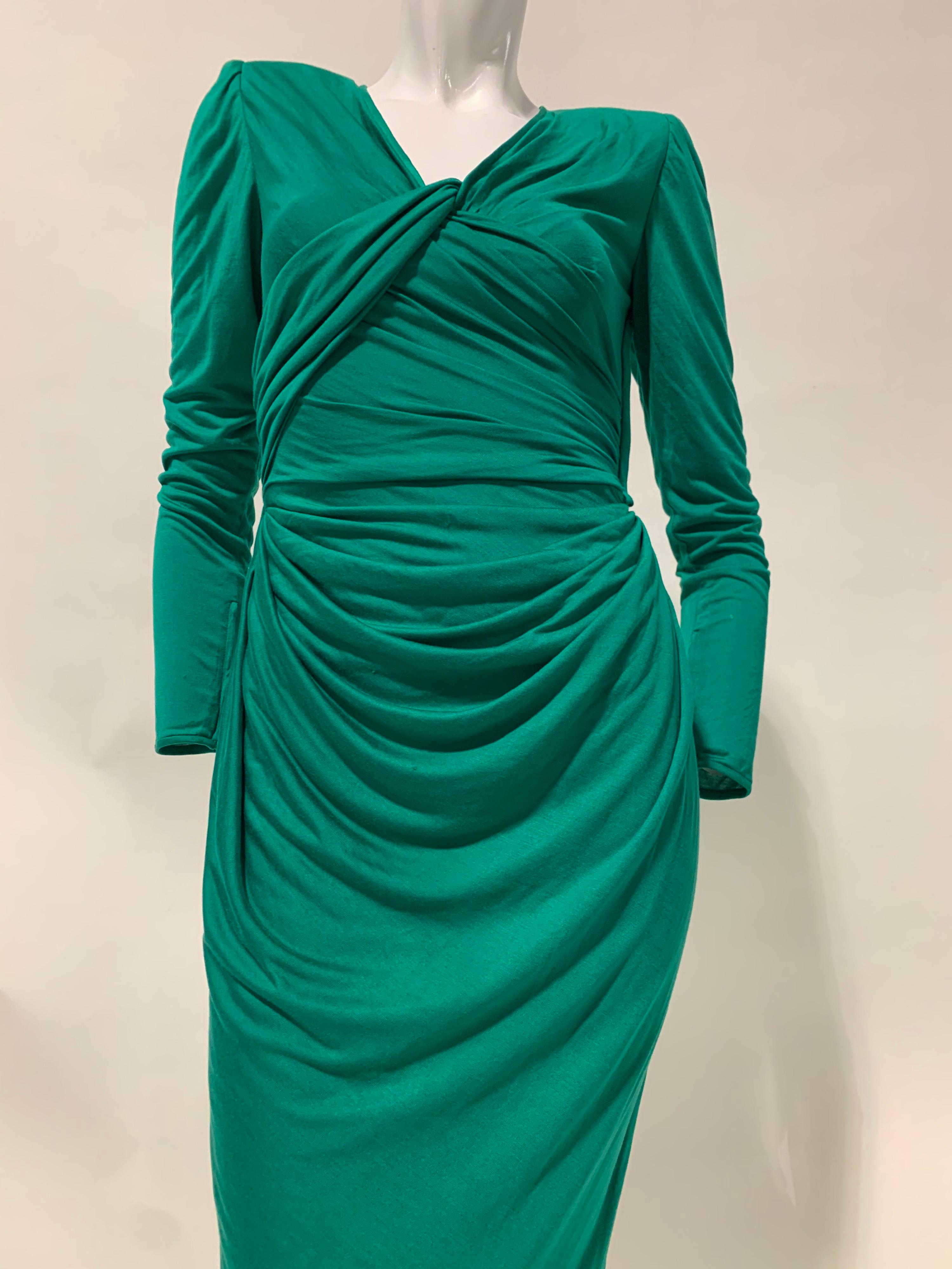 1992 Emanuel Ungaro emerald green rayon and silk blend jersey gown: Masterfully draped with vented wrap back and bold padded shoulder silhouette. Marvelously slinky and comfortable. Side zip and snap closure. Long tapered and zippered sleeves. Size