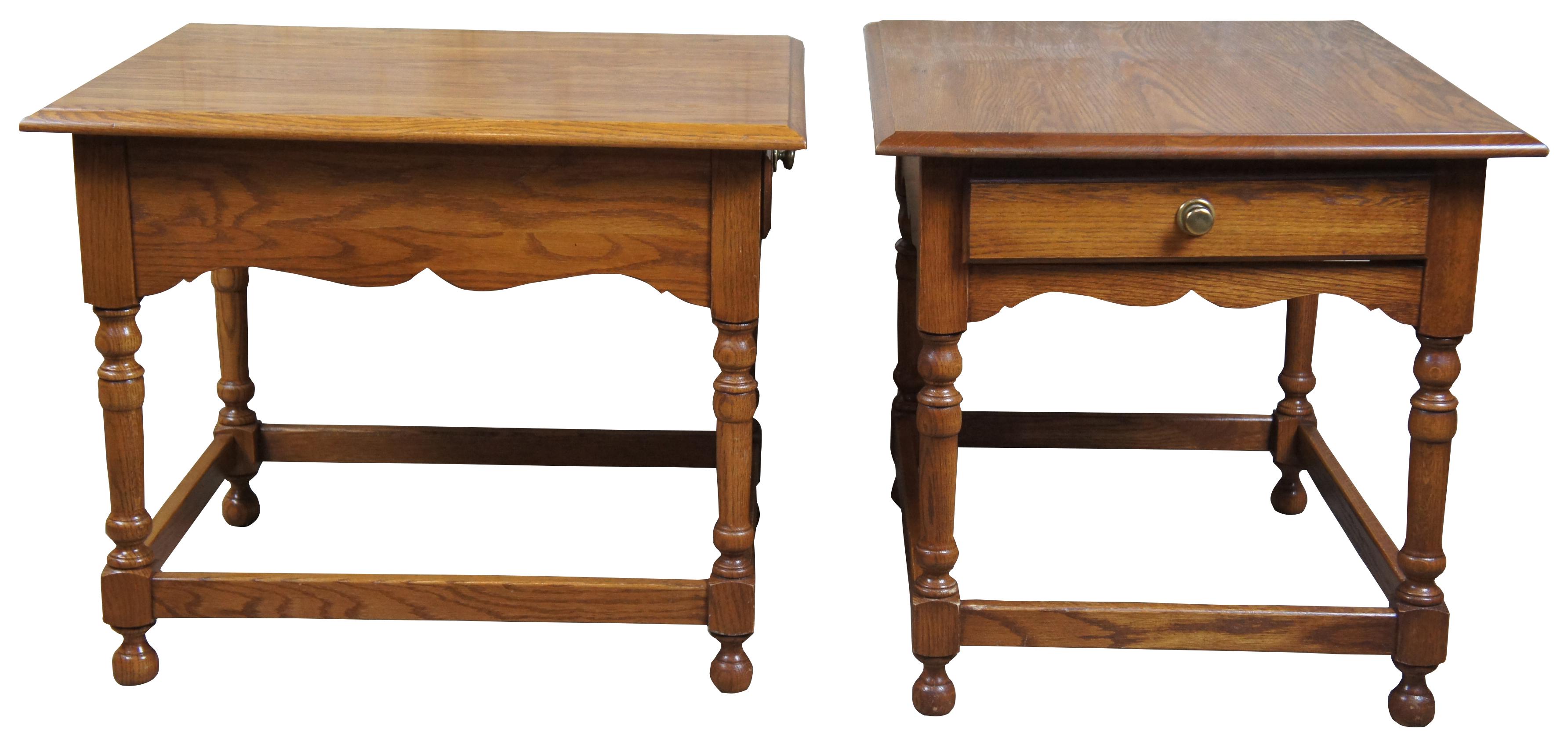 Oak end tables by Pennsylvania House. This rectangular table features a single drawer and a serpentine apron; the drawer is equipped with a brass tone knob pull and is marked “Pennsylvania House” to the interior.
 