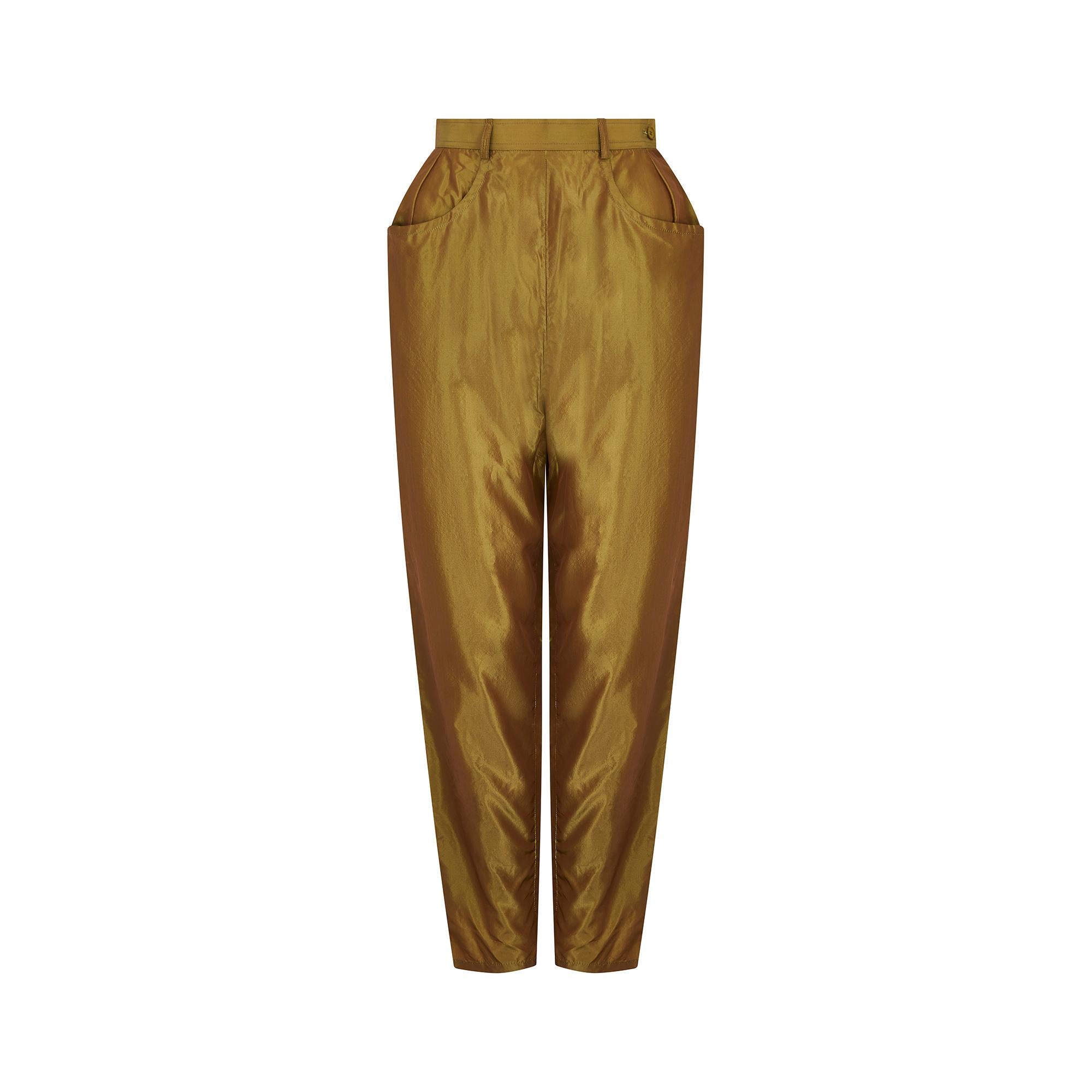 1992 Spring/Summer runway documented iridescent peg trousers by Yves Saint Laurent from his Rive Gauche line, featuring a fitted high waist and a side zip with top button closure. The fabric is a soft 100% silk, with an iridescent shine that
