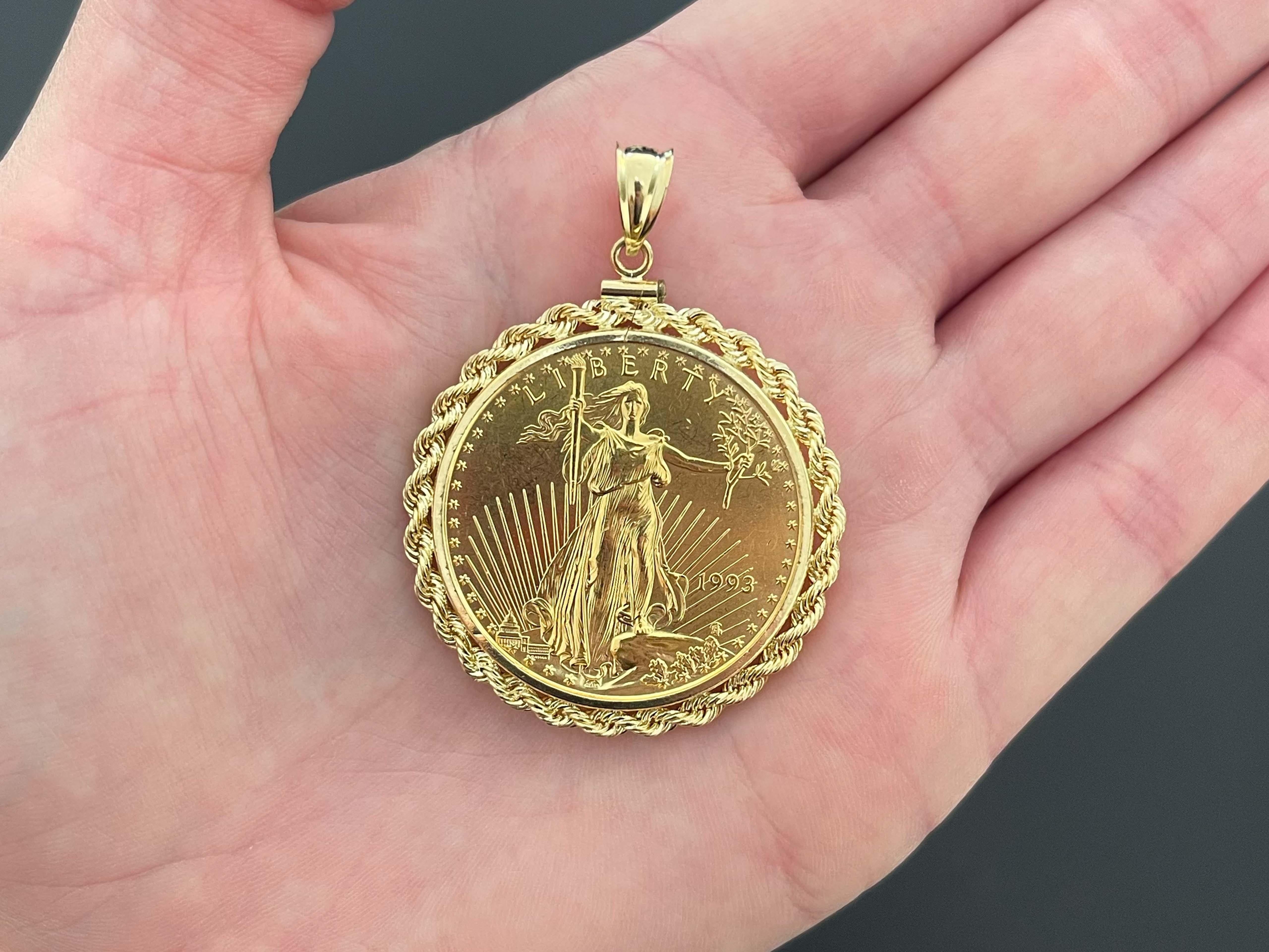 This pendant contains one $50 American Eagle gold coin with 1 ounce of pure gold. The coin is set in a 14K gold rope design bezel. The pendant is 1.5