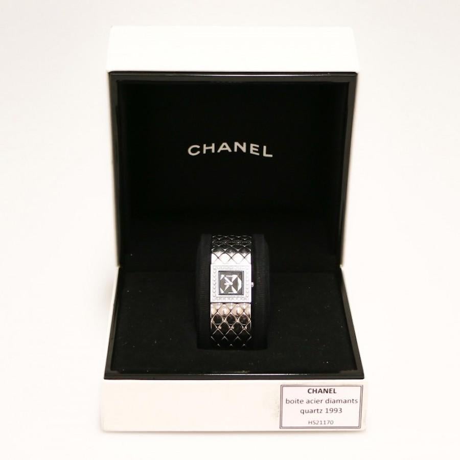 Elegant CHANEL steel and diamonds watch from 1993 delivered in original CHANEL box 
Condition: very good (micro scratches)
Made in Switzerland
Model: quilted, ladies
Movement: quartz
Diameter: 19 mm, 
Material: steel, diamonds
Year: 1993
Dial: