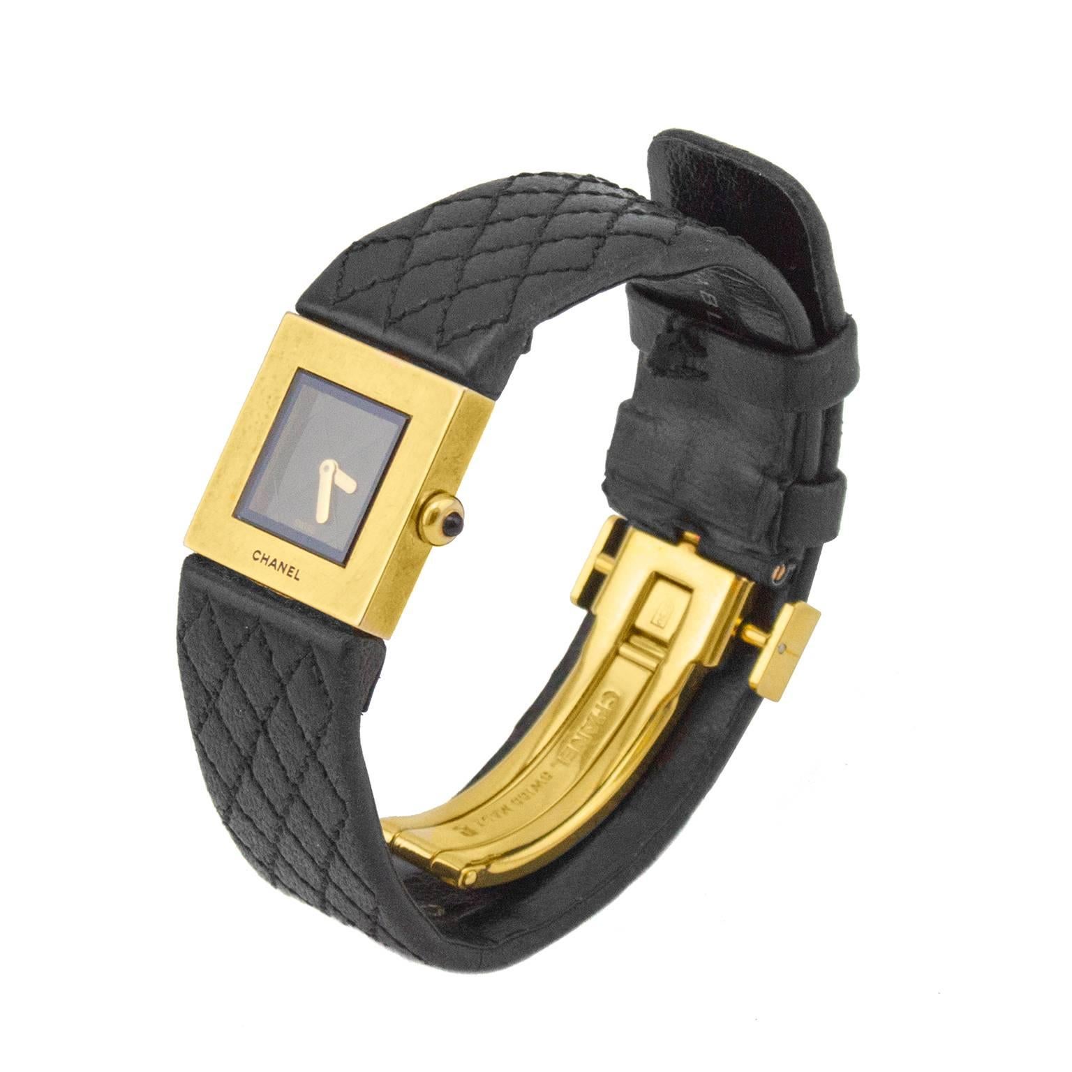 Chanel 18 karat gold and black leather quartz wrist watch dating from 1993. The epitome of understated elegance. Black square face with monochromatic quilted pattern. Stick gold hands, square gold smooth bezel, sapphire crystal face and gold