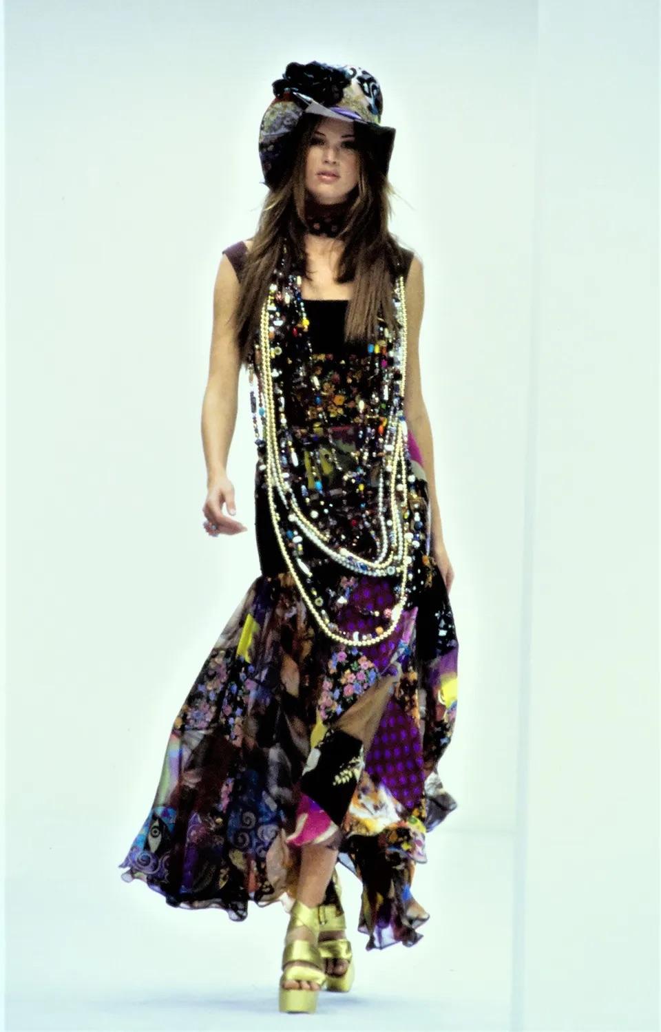 A highly coveted and ultra chic Dolce & Gabbana multi-colored patchwork hourglass flounce gown dating back to their epic 1993 spring/summer collection. As pictured, this striking look was also featured on Naomi Campbell for El Pais magazine. Dolce &
