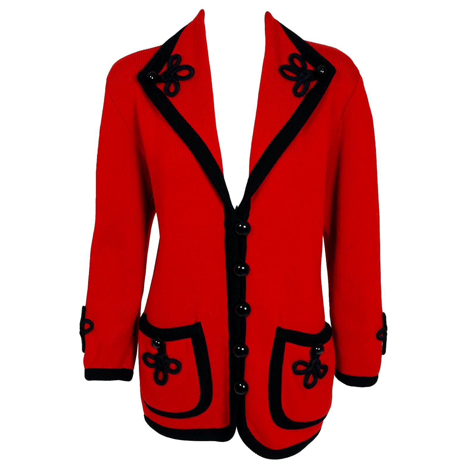 Gorgeous Givenchy documented ruby-red wool knit cardigan dating back to his 1993 Fall-Winter Couture collection. Givenchy, the name itself evokes glamour, refined elegance, simplicity and style. Givenchy's trademark of sculpted lines and luxurious