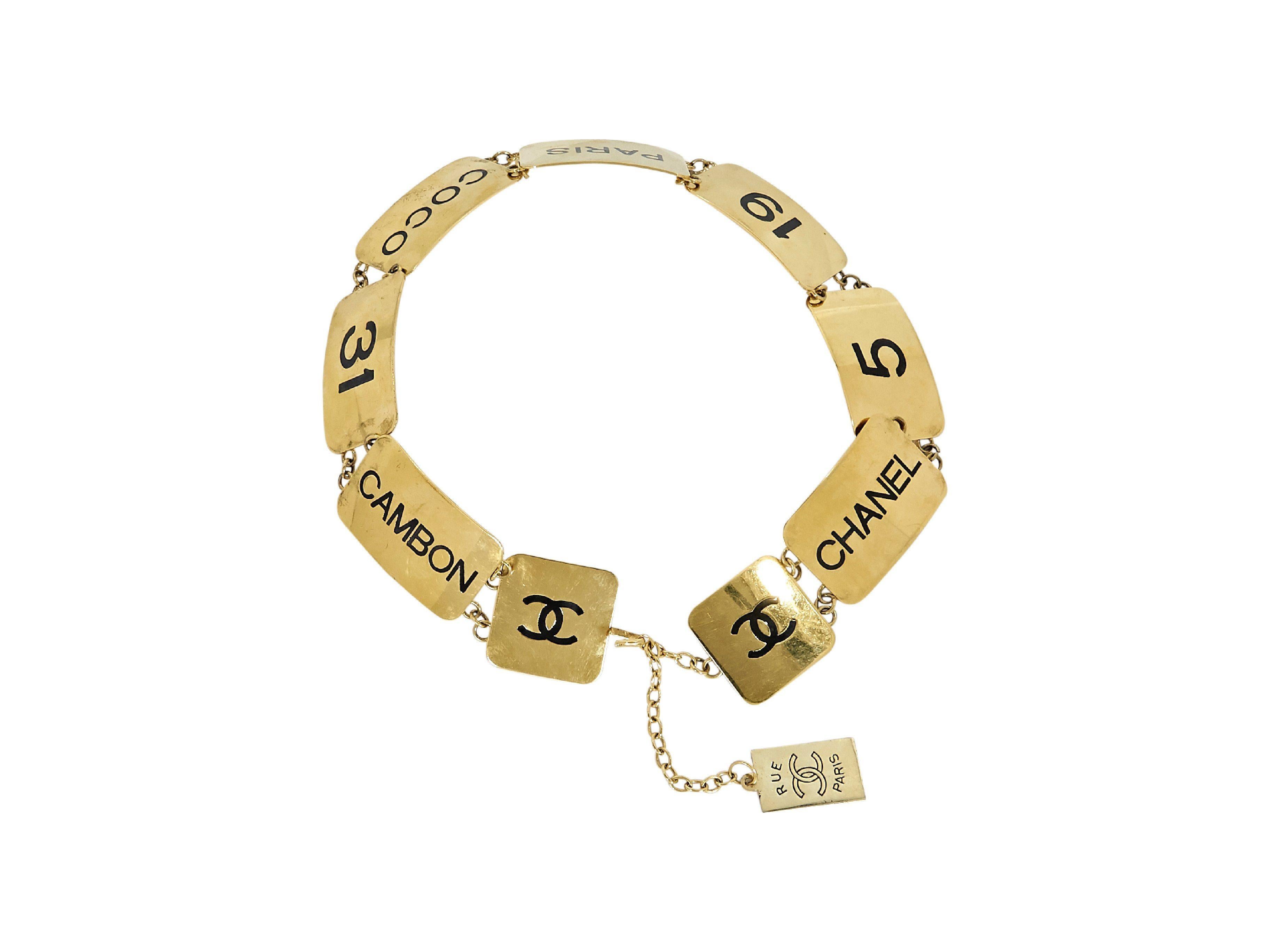 Product details:  Vintage gold plated brass belt by Chanel.  Adjustable hook closure. Signature interlocking CC logo. 27-33