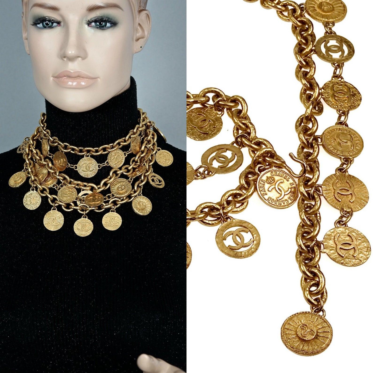 Features:
- 100% Authentic CHANEL from 1992 collection.
- Chunky chain and jumbo charms in gold tone.
- Compose of 9 massive Chanel logo charms - Cut Out CC logos, Coco Mademoiselle, elephant and wheat .
- Signed CHANEL 2 CC 9 Made in France.
- Hook