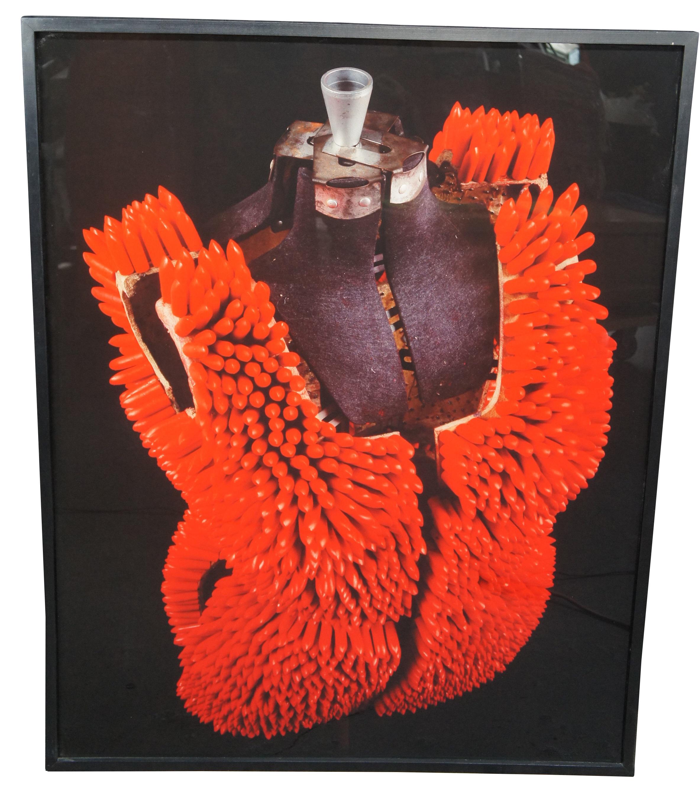 Vintage 1993 Lipstick Dress 1, 2 & 3 by Janet Biggs.  Features a trio of cibachrome photograph panels depicting lipstick armour on a mannequin form.

Janet Biggs, American, b. 1959.
Janet Biggs is an American artist, known for her work in video,