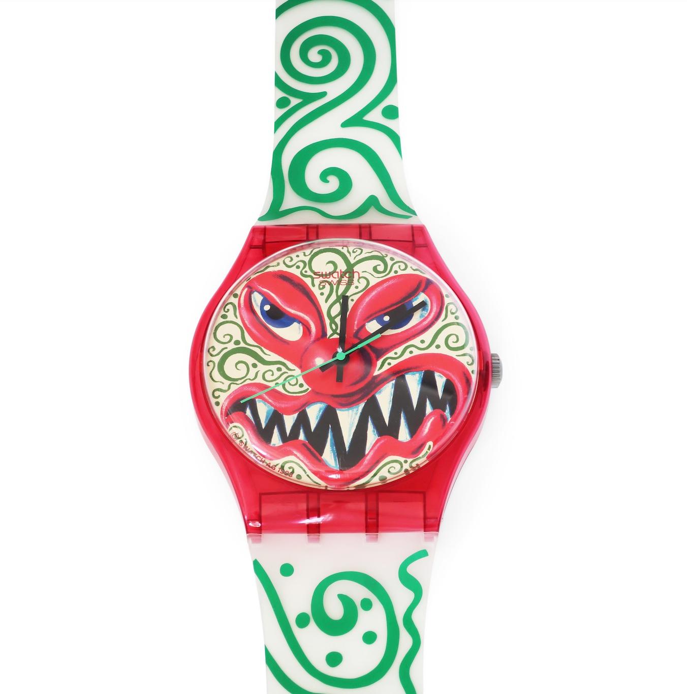 A charismatic and sinister design from 1993 by American artist Kenny Scharf for Swatch. Produced as a wristwatch and also in this Swatch Maxi over-sized seven foot tall wall clock version. Scharf's work is humorous, pushes boundaries, and is always