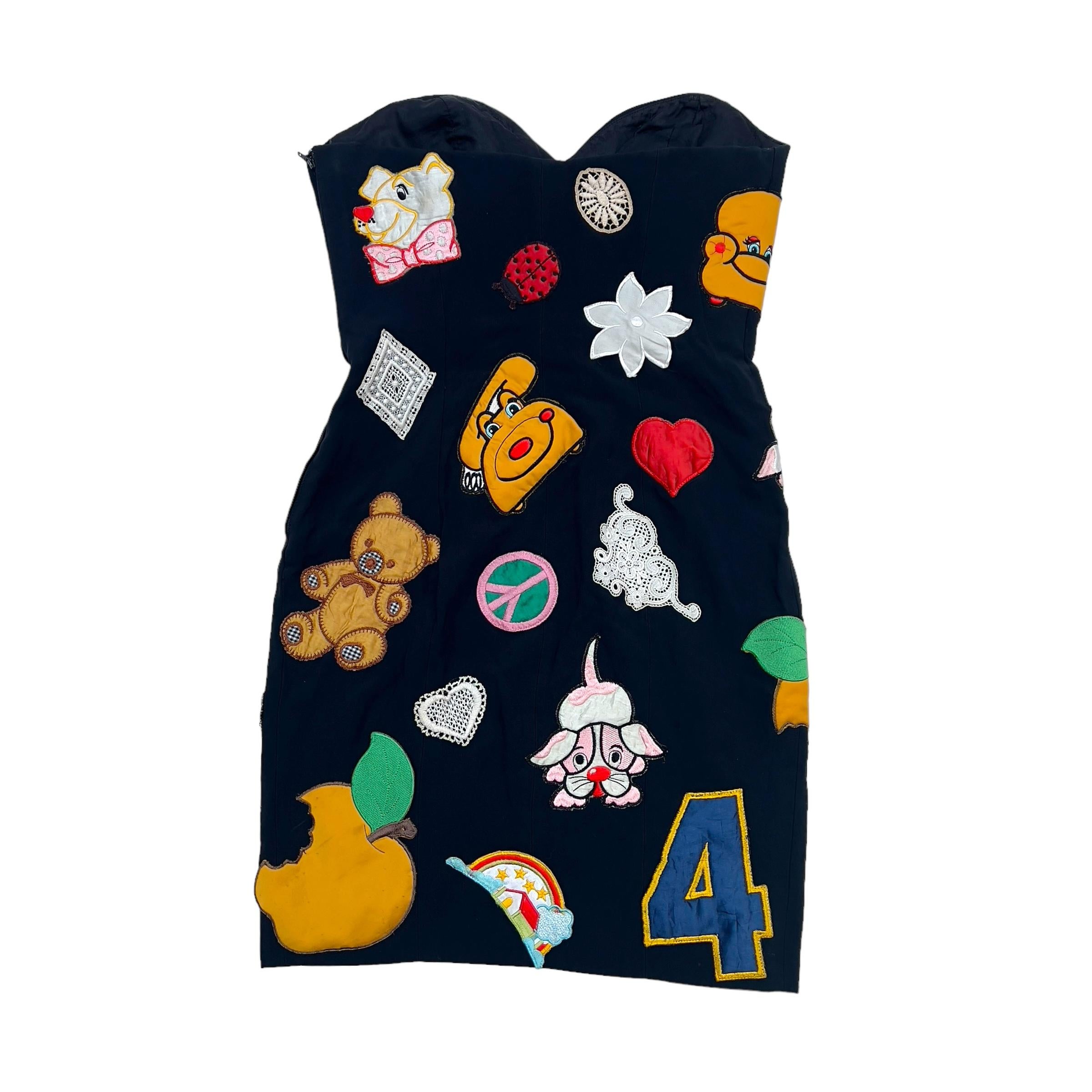 Vintage 1993 runway kiss my patch/ WHAM dress Moschino Couture. Moschino, the renowned Italian fashion brand founded by Franco Moschino, shocked the fashion world with its 1993 final collection titled 